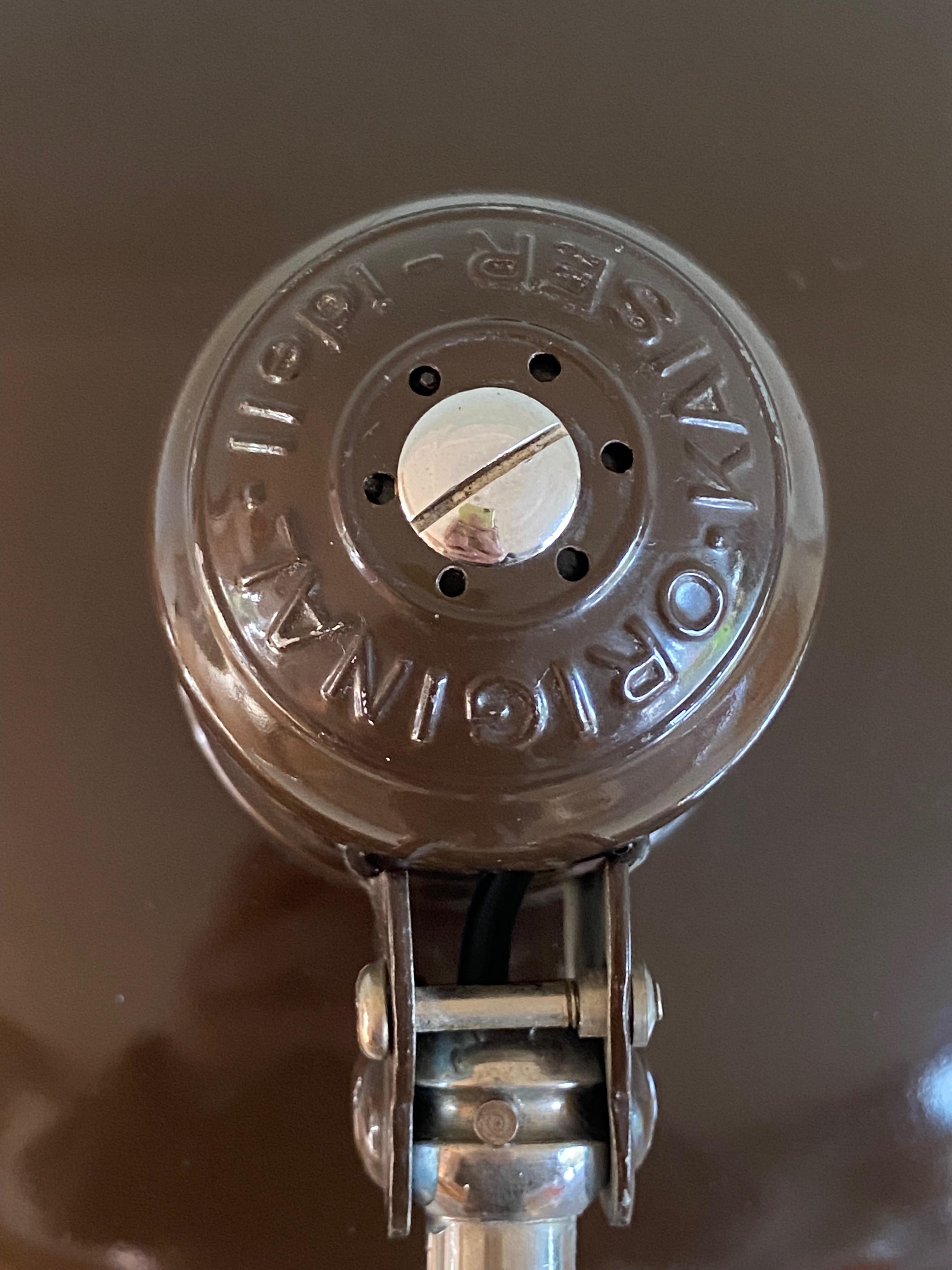 Original brown Christian dell desk lamp model 6631 Luxus / president for Kaiser Idell, Germany. Most of them are in black. Chromed arm and rim. Arm and shade adjustable. With E26/27 Edison screw socket. Very nice condition and ready to use with 110