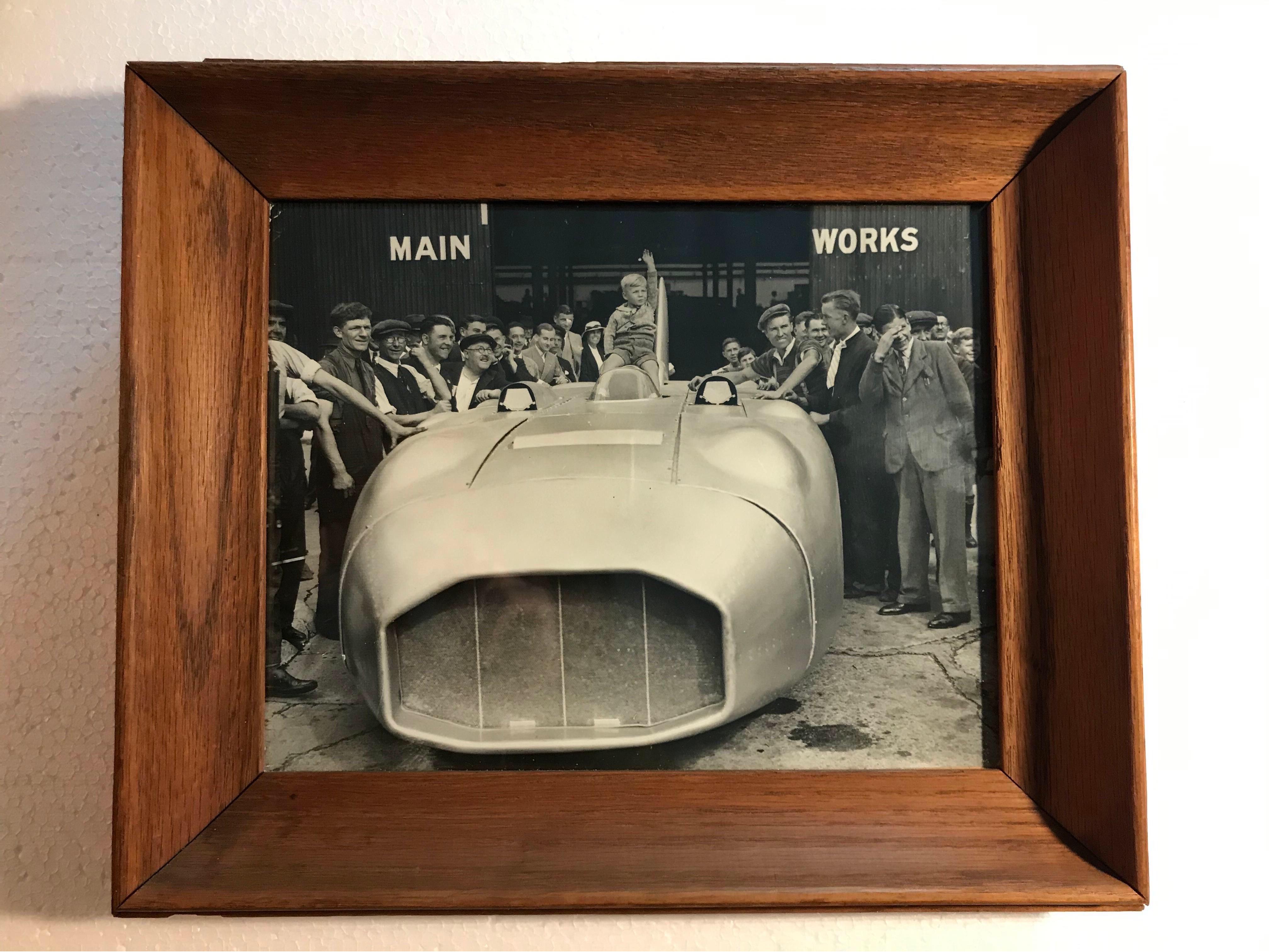 Original vintage B&W press photo from 1937 of the world land speed rekord car Thunderbolt with 5000 bhp and 312 mph.
Driven by Captain George Edward Thomas Eyston MC OBE (28 June 1897 – 11 June 1979)
Mounted in a vintage solid oak frame.