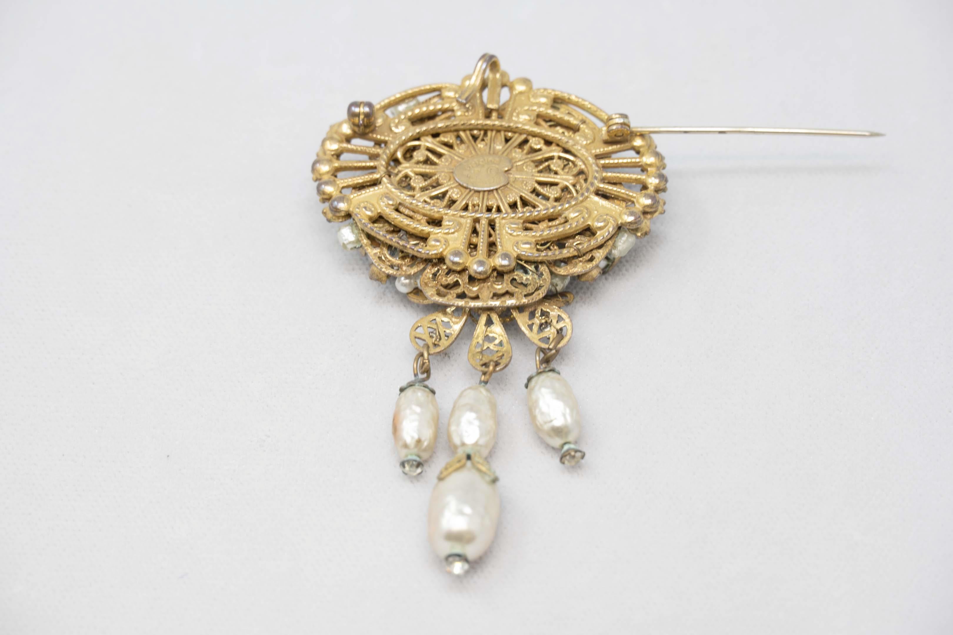 Original by Robert faux pearls and rhinestones brooch. Measures 3 1/4 inches long. Mid 20th century 1960. Wear consistent with age, crystal pearls.
