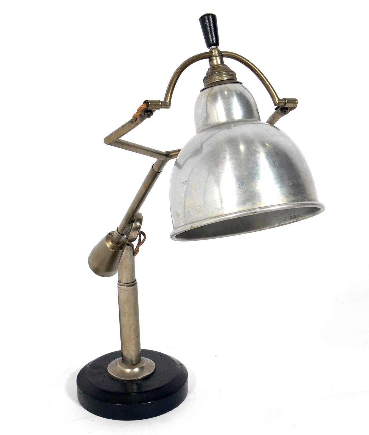 Original cantilevered Art Deco lamp, designed by Edouard-Wilfred Buquet, France, circa 1925. Signed with applied metal manufacturer's label to underside: [Buquet BTE S.G.D.G]. Currently wired for European outlets, tested and functions properly. Can