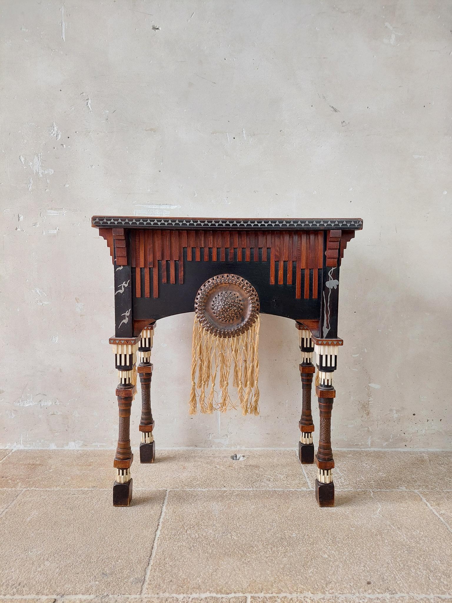 This unique tea table / sewing table is from the well-known designer Carlo Bugatti.

Carlo Bugatti was a prominent Italian designer. Best known for his associations and contributions to the Art Nouveau movement. Born in Italy, Milan, 1856. He