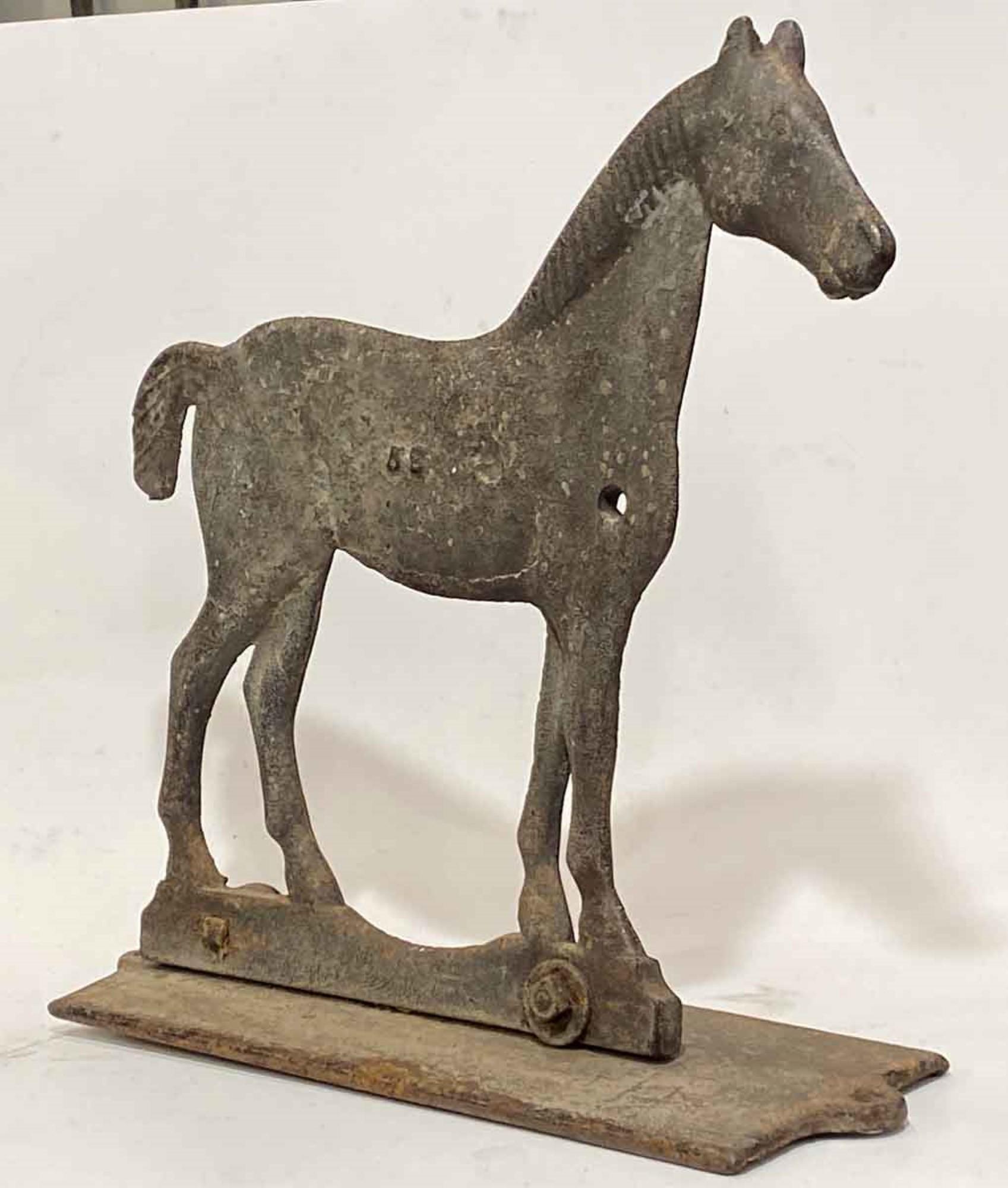 1920s antique cast iron horse windmill weight from the Midwest. Still mounted on the original cast iron weight box cover. Made by Dempster Vaneless Windmills. This can be seen at our 333 West 52nd St location in the Theater District West of