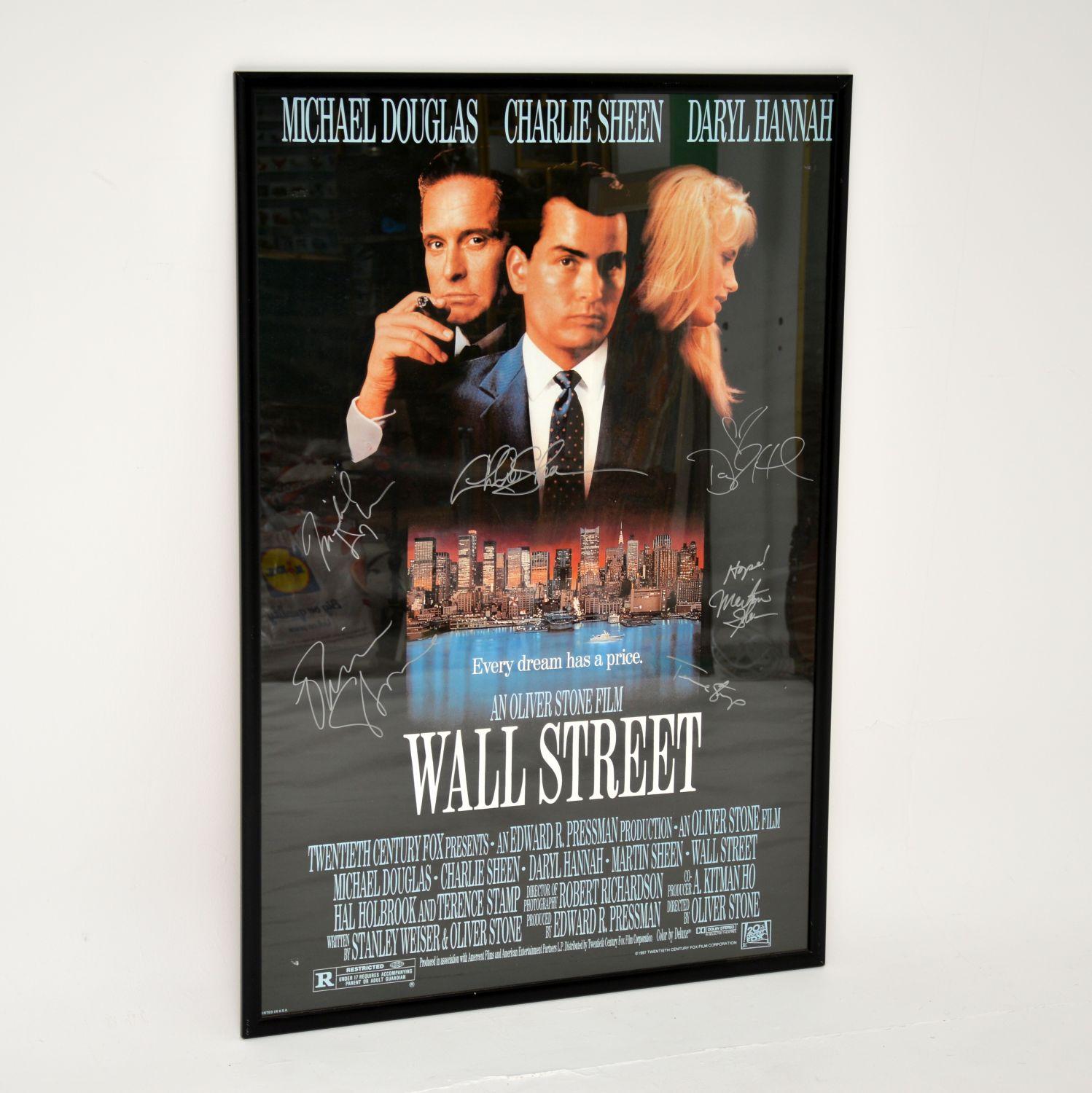 An amazing original Wall Street film poster, signed by the cast and framed. This would date from the late 1980’s when the film was released.

It is a rare and very collectable item, and is signed by the main cast: Charlie Sheen, Michael Douglas,