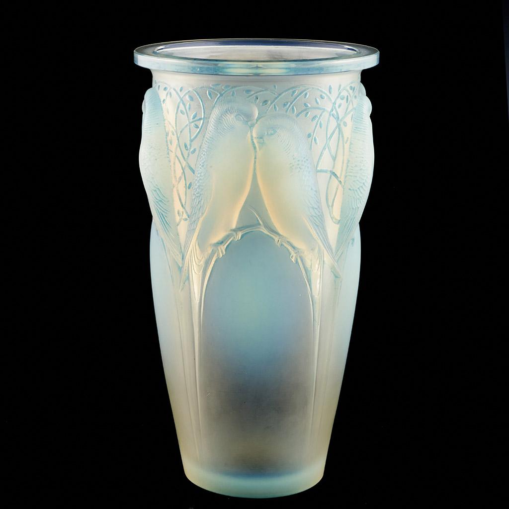 Ceylan, a frosted and opalescent glass vase. Hand etched R Lalique underside.  Fantastic Electric blue opalescence with love birds perched on opalescent branches. Excellent Condition.

René Jules Lalique (French, 1860–1945) was a renowned jeweller