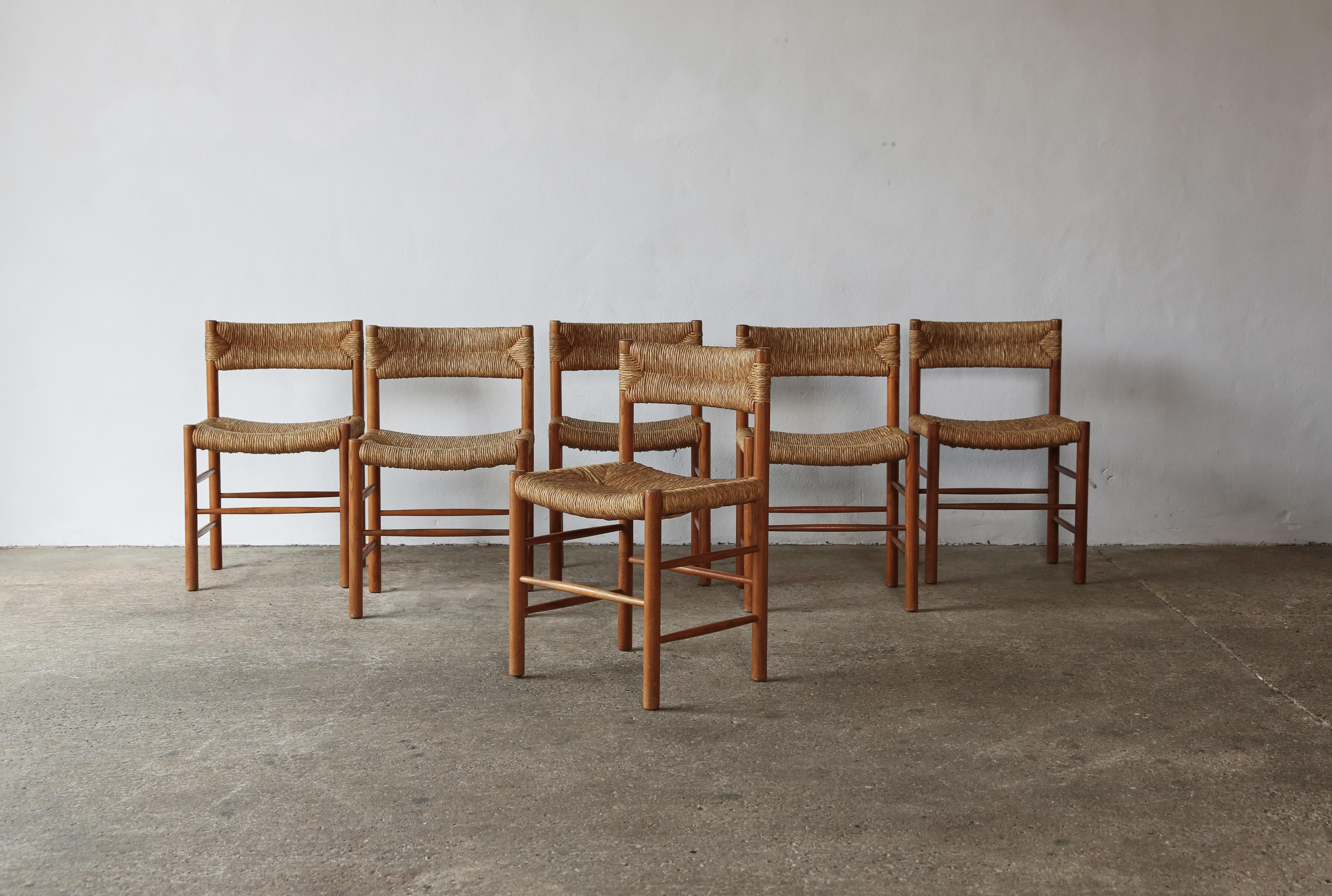 A set of six original Charlotte Perriand / Robert Sentou Dordogne chairs, France, 1960s. Wooden frames in original condition, good structural condition, with minor signs of use and wear relative to age. Original rush seats and backs in good