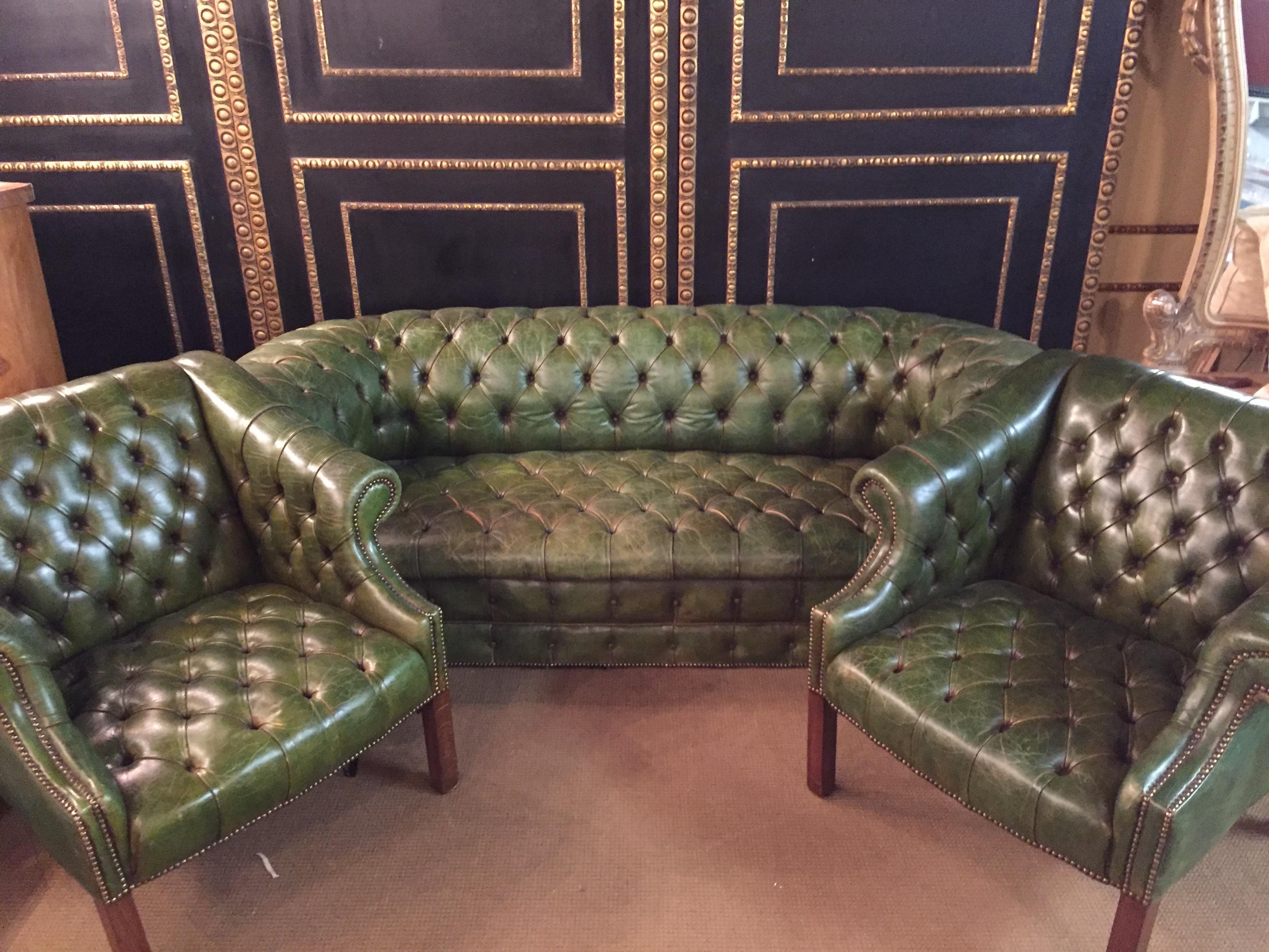 Original old Chesterfield set, quilted seat and back strong Leather.
This unique set was bought in an antique shop in 1978, real leather with original invoice.
Colour is faded green, the inside is filled with horsehair,
seats are with classic laced