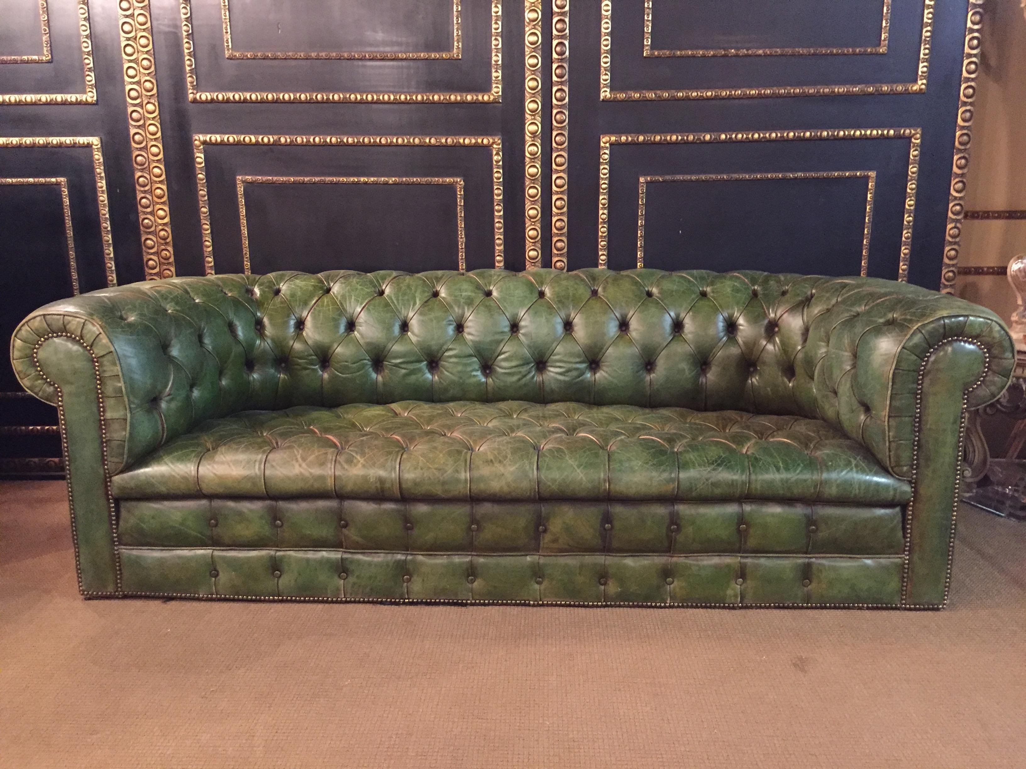 Original old chesterfield sofa, quilted seat and back strong leather. This unique sofa was bought in an antique shop in 1978, real leather with original invoice. Color is faded green, the inside is filled with horsehair, seats are with Classic laced