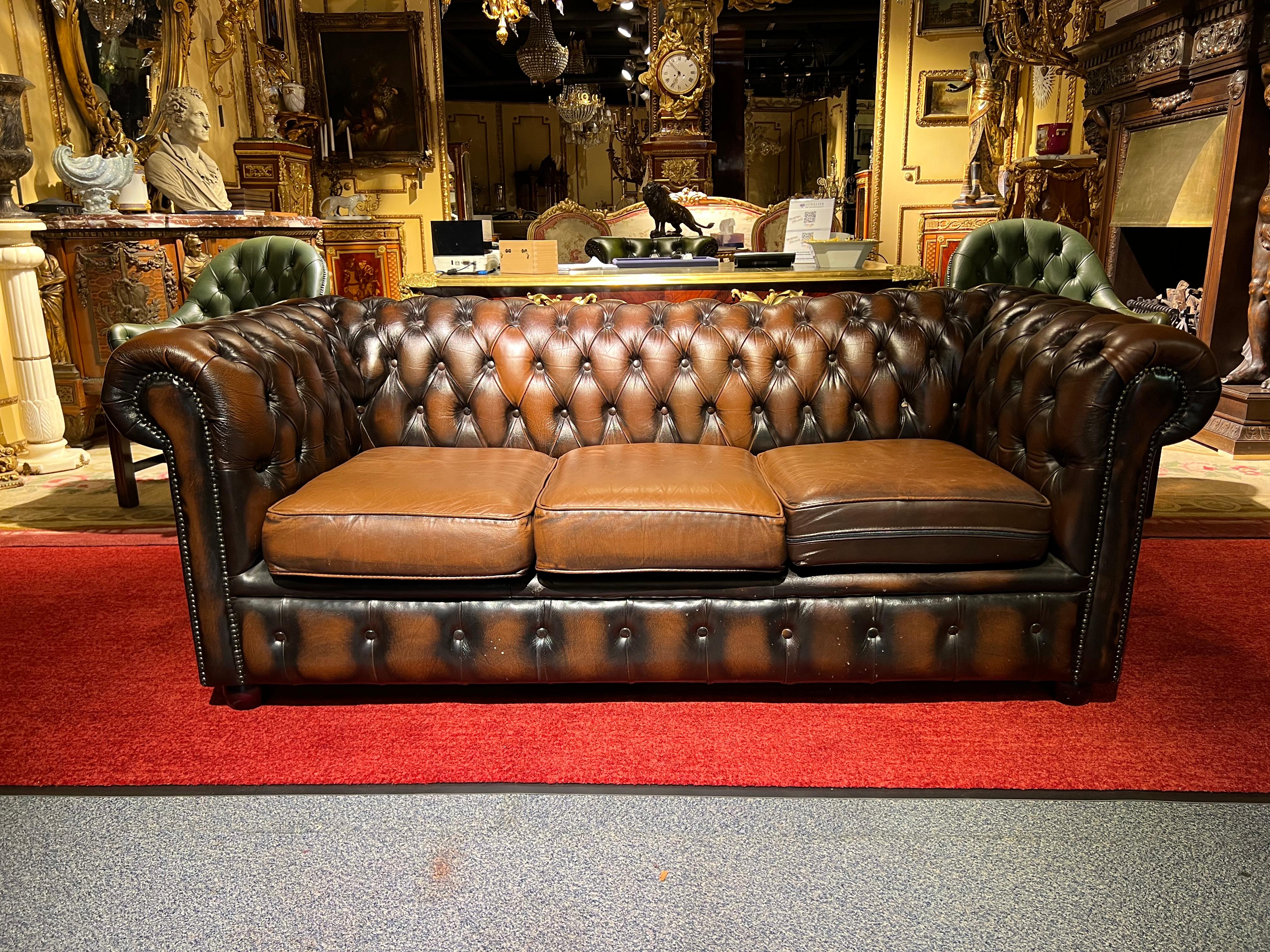 We are delighted to offer this stunning rare handmade in England brown leather 3-seat, sofa. Where to begin! This sofa is absolute eye candy from every angle, it has the original leather hide, it has been hand dyed this lovely and bespoke brown