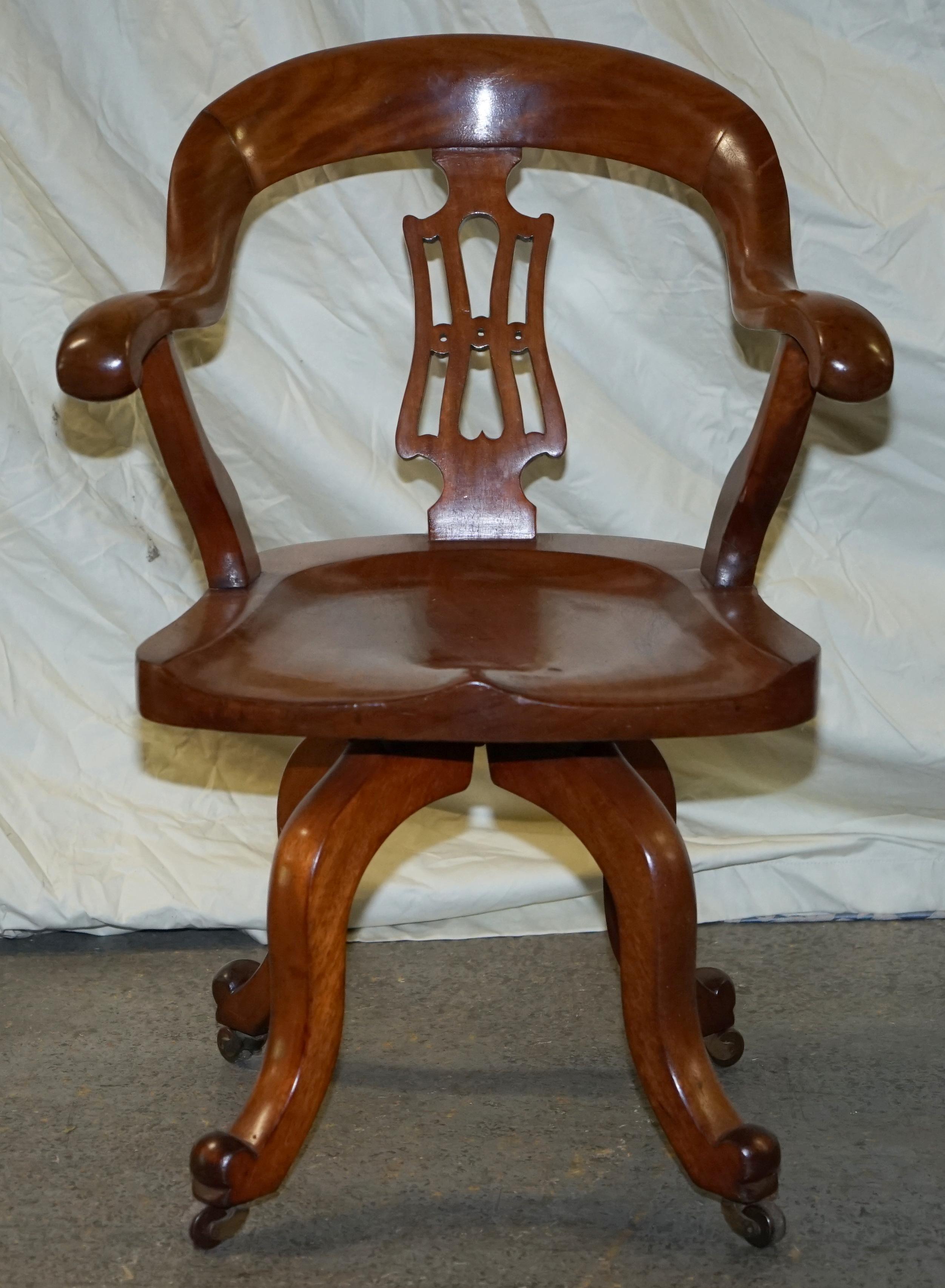 We are delighted to offer for sale this stunning original circa 1860 solid walnut Victorian captains chair with sculptural frame

A very original and good looking piece, the arms are highly sculpted and are very comfortable for a solid wood chair.
