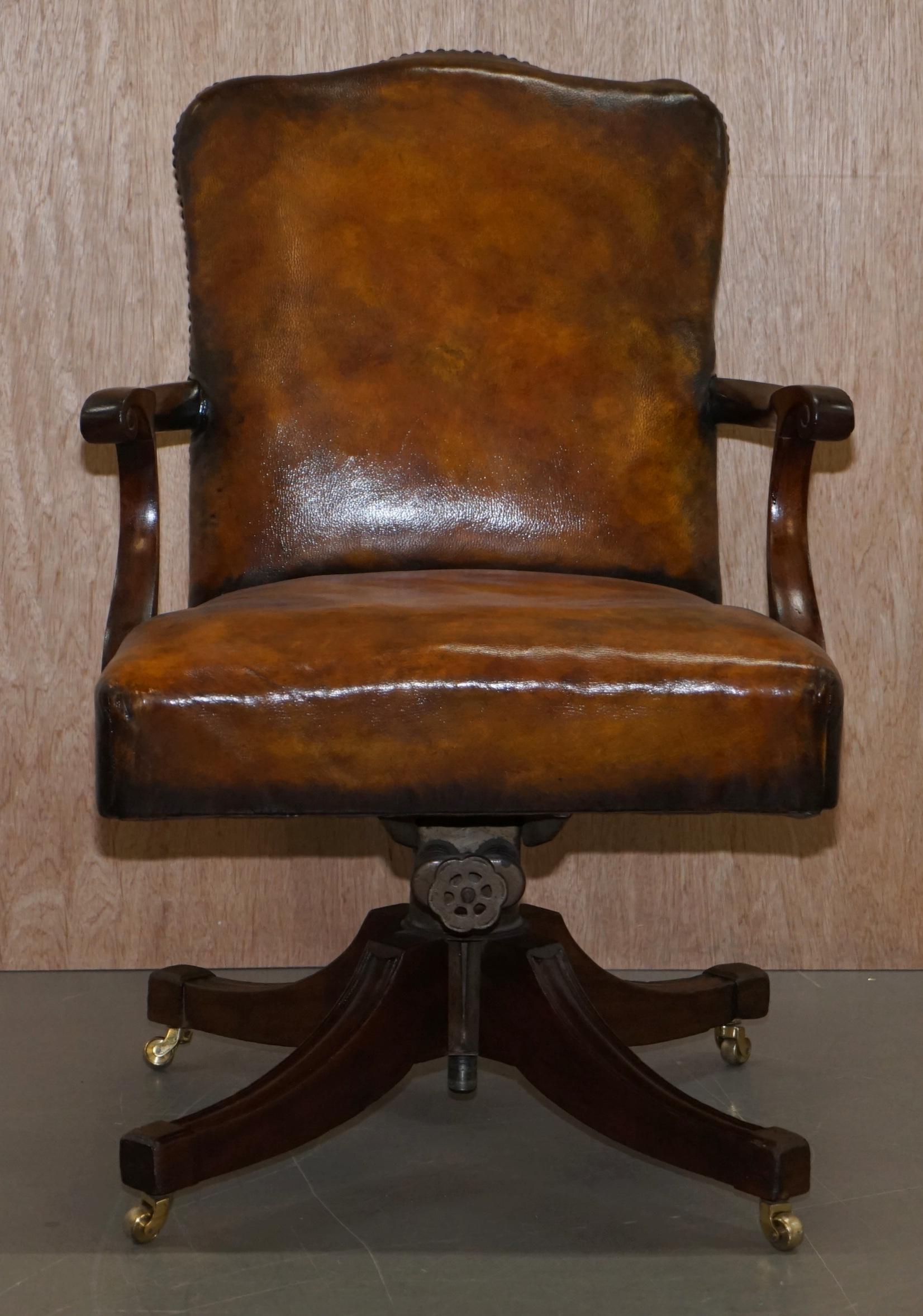 We are delighted to offer for sale this stunning original Victorian stamped Maple & Co fully restored mahogany framed Hillcrest base office chair with hand dyed brown leather upholstery

A stunning piece, the frame is solid and beautifully crafted