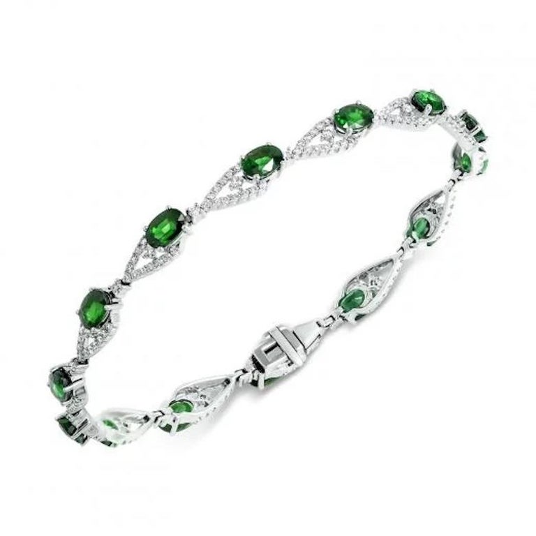 Bracelet 14K White Gold (Also Blue Sapphire Bracelet Available)
Diamond  26-RND57-0,42-4/6A
Diamond 167-RND 57-1,19-4/7A 
Emerald 13-4,97 3/(5)З
Weight 10,03 grams
Size 18.5

With a heritage of ancient fine Swiss jewelry traditions, NATKINA is a