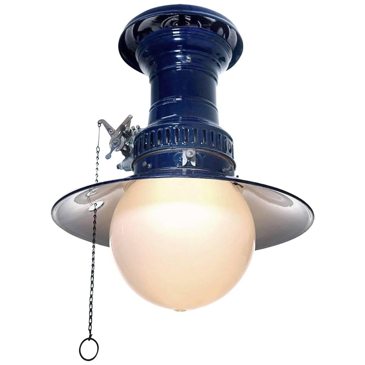 You don't see these in cobalt often. It in beautiful condition with the original globe and matching shade. Note the hole in the shade to allow the chain to hang straight. We kept all the original gas components when wiring for a standard bulb and
