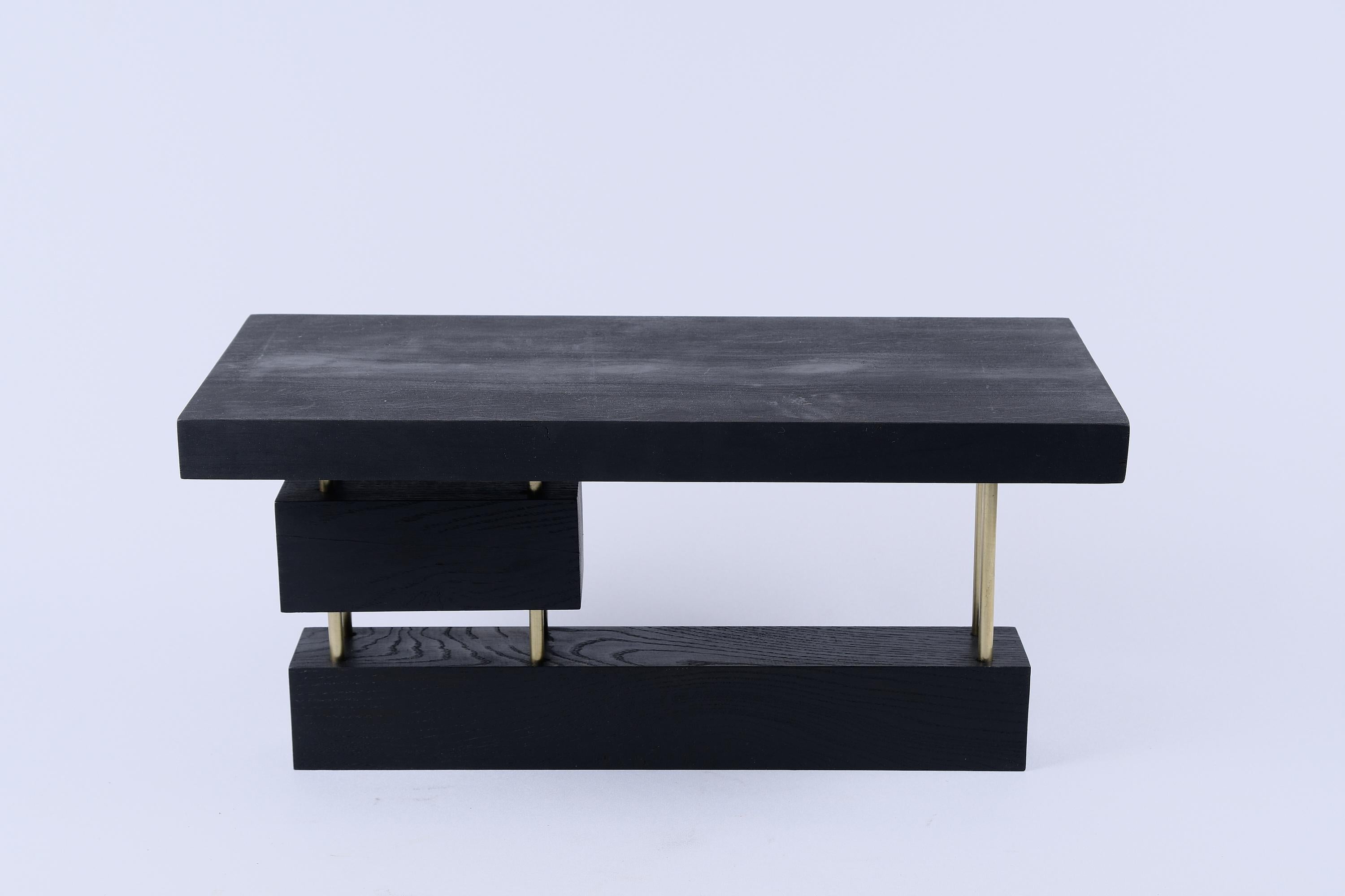Unique wooden piece usable as a side table or simply as a decorative object. It is build in combination of high quality burnt oak & brass, and protected with the highest quality oils, ensuring durability for generations. Such unique handmade design
