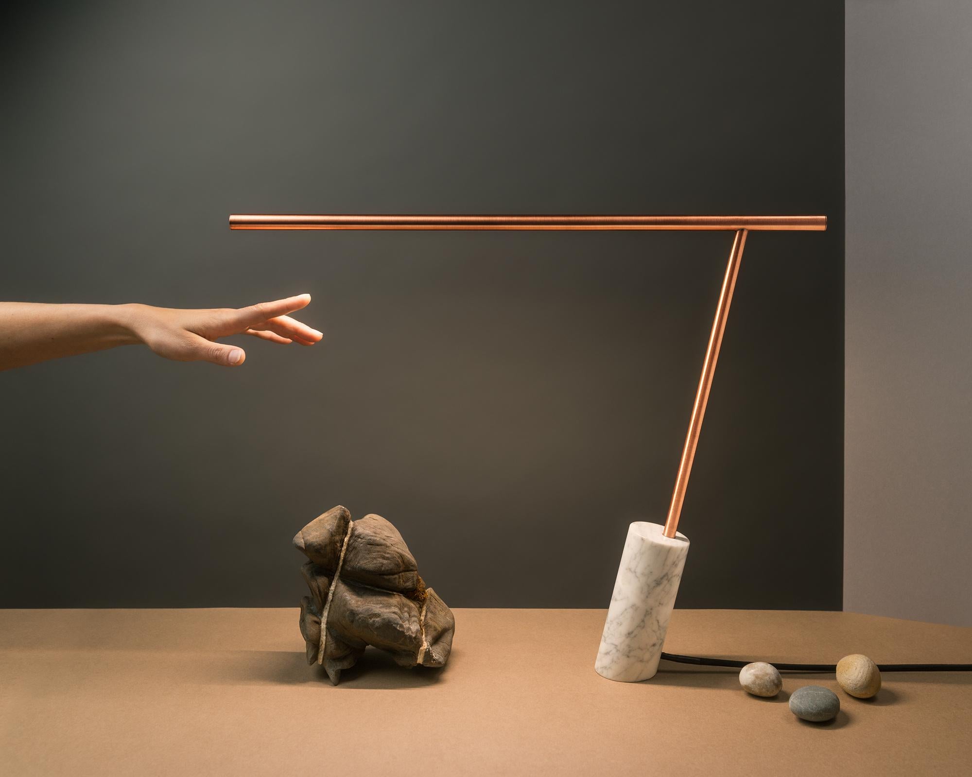 Original copper marble table lamp signed by Adam Ruiz & Cyril Fuchs
Dimensions: 45 x 57 x 4 cm
Materials: Varnished copper and Carrara marble
Hand scultped, signed.

Minimalist, this desk lamp named 0.47 for its proportion ratio is