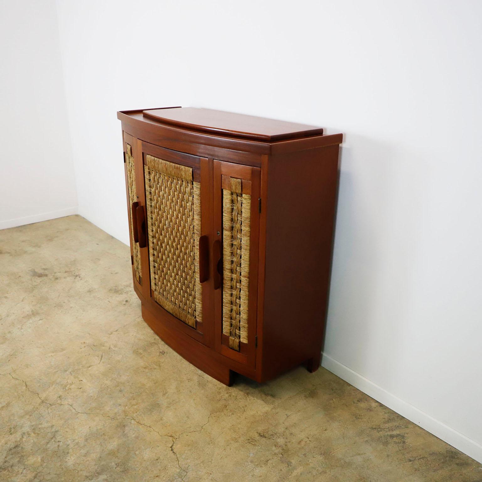 Circa 1960. We offer this rare and Original Bar Credenza in the style of Clara Porset, made in solid wood and seagrass, recently restored professionally.