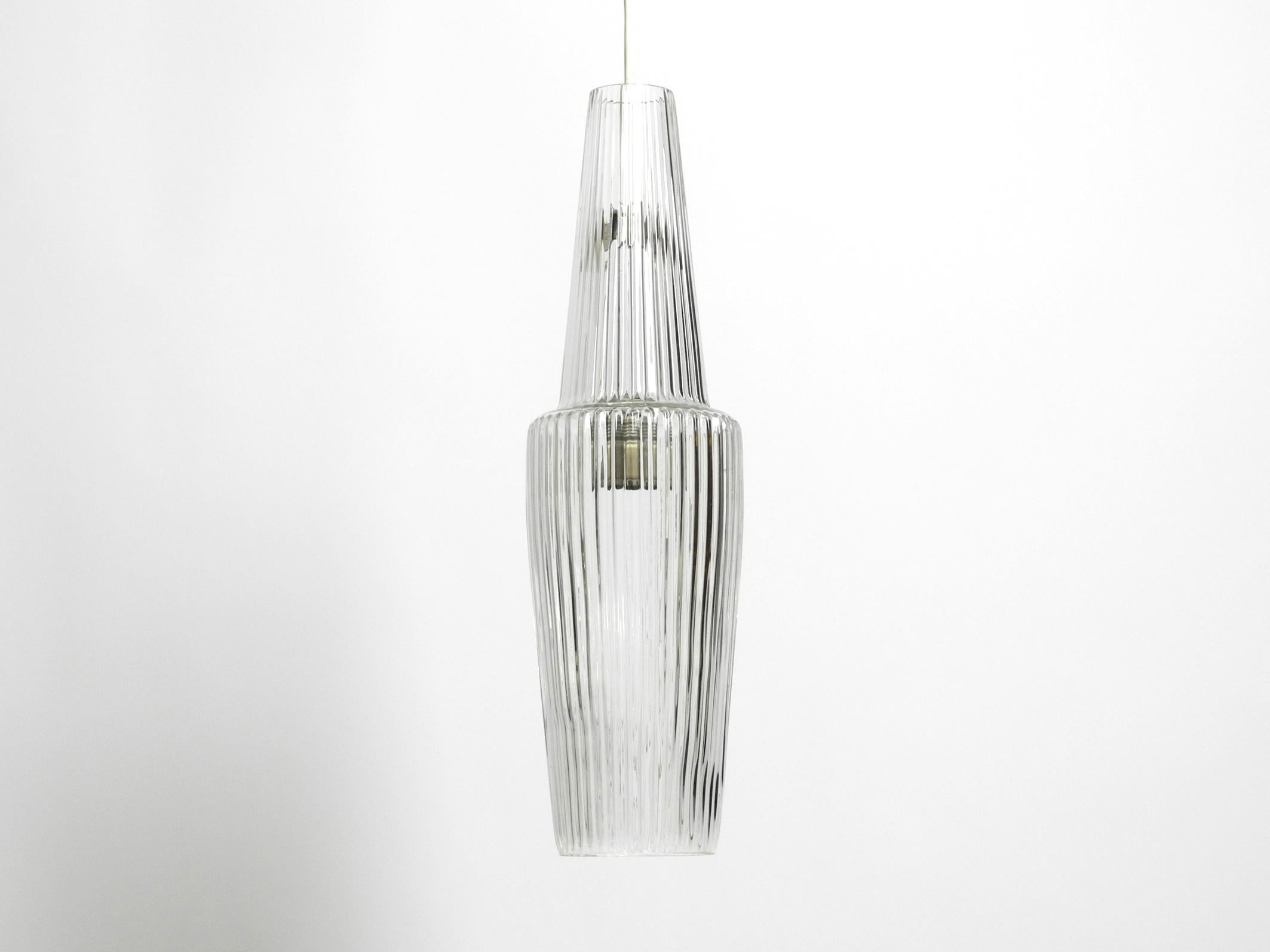 Rare original hand-blown crystal glass pendant lamp 'Pisa' by Aloys Ferdinand Gangkofner.
Manufactured by Peill & Putzler. An original from 1952. Made in Germany.
Beautiful minimalist Mid Century design.
The lamp is an original from the 1950s and