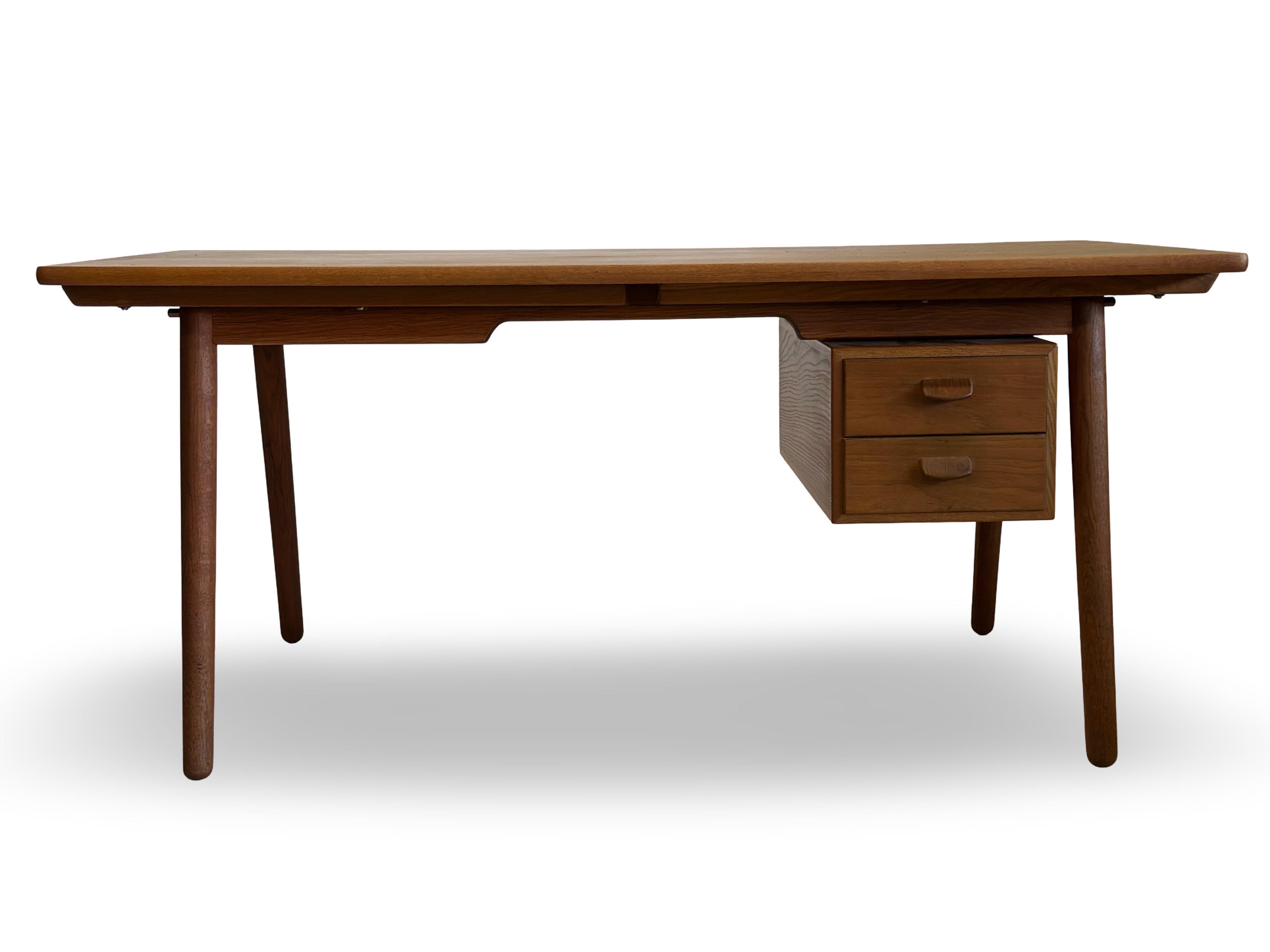 Original teak desk designed by Poul Volther in 1958 and manufactured by FDB Møbler. 2 extensions and a removable casette with drawers. Rare and beautiful model. 2 extensions each measure 47 cm. Total max length of the desk is 254 cm.