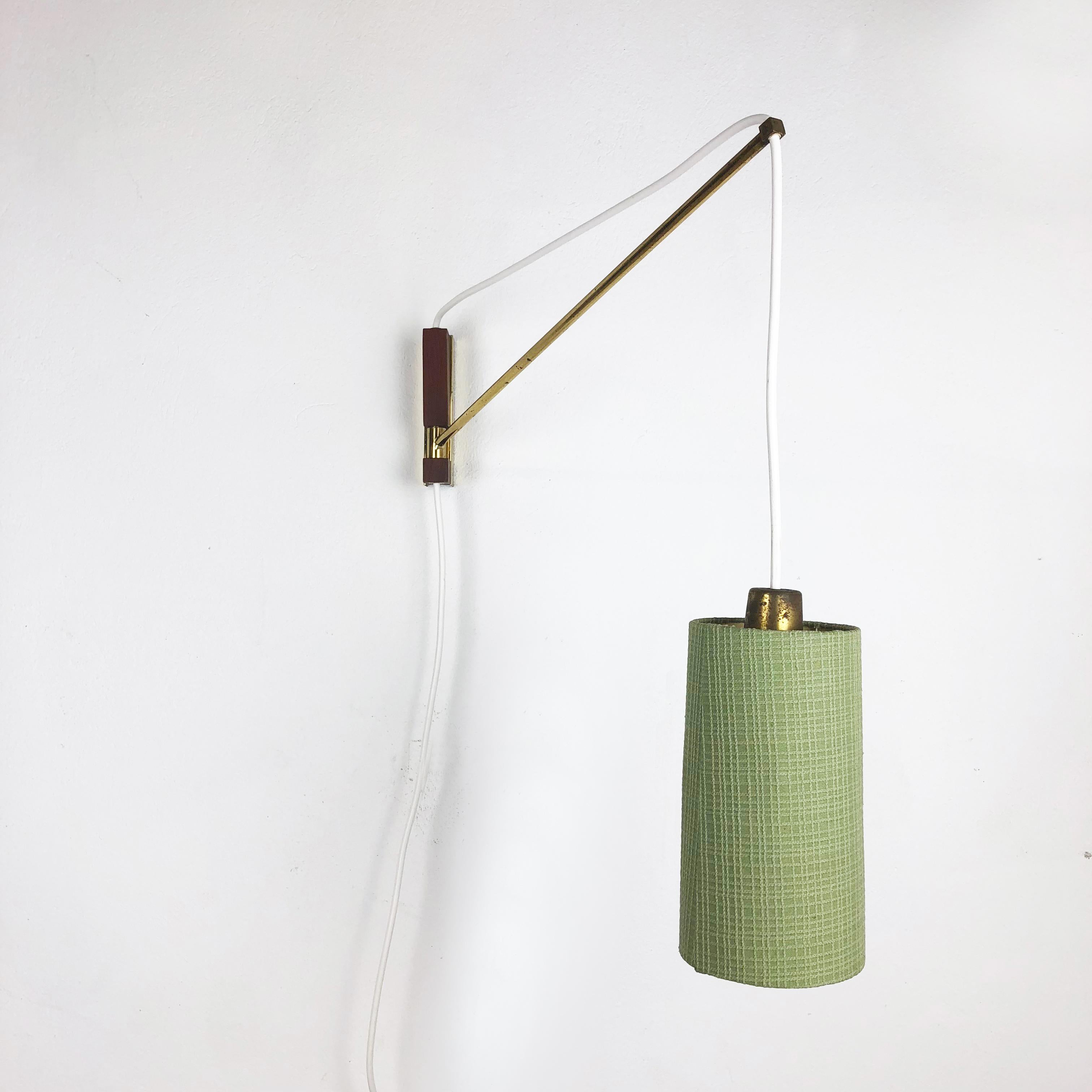 Article:

Wall light 


Origin:

Denmark


Decade:

1960s



Description:

This wall light was designed and produced in Denmark in the 1960s. The wall fixation of this light is made of metal with brass tone finish with a teak wood
