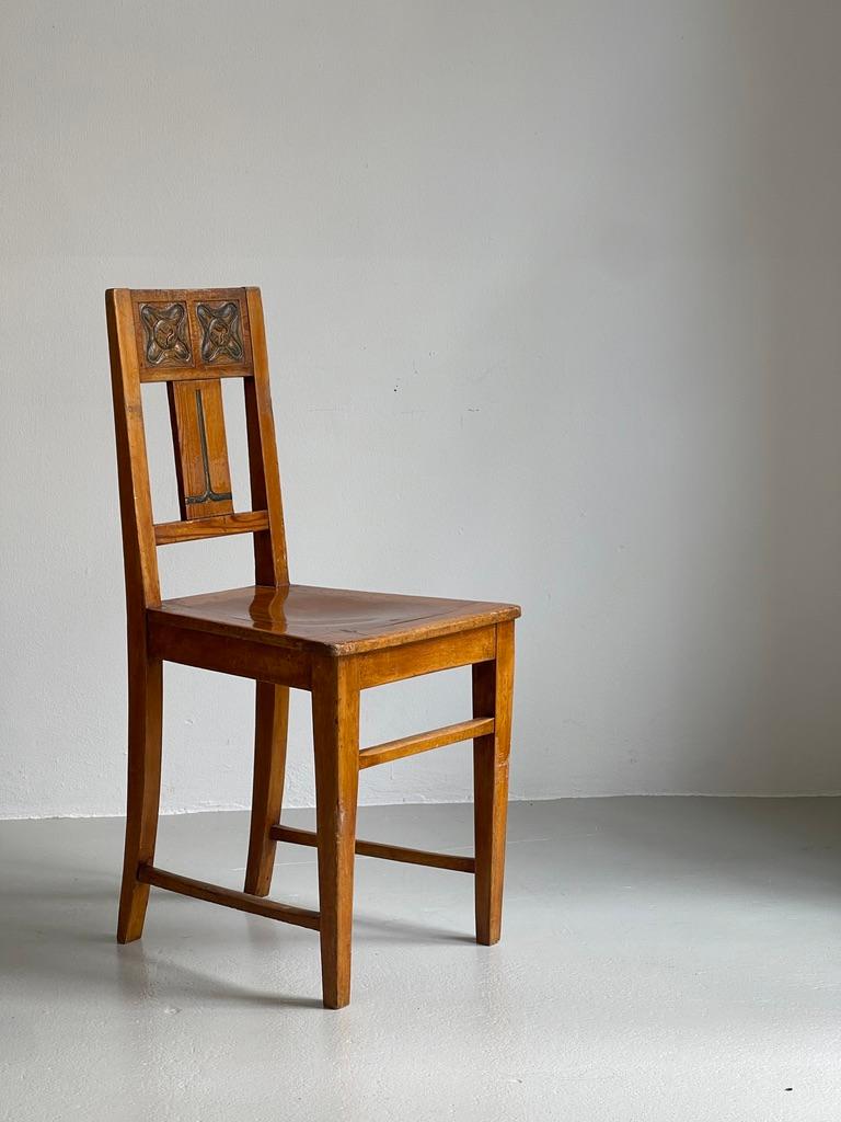 This original Danish Arts and Crafts chair, crafted circa 1895 from pine and beech, embodies the movement’s dedication to honest materials, fine craftsmanship, and expressive yet restrained ornamentation. The chair features a delicately carved