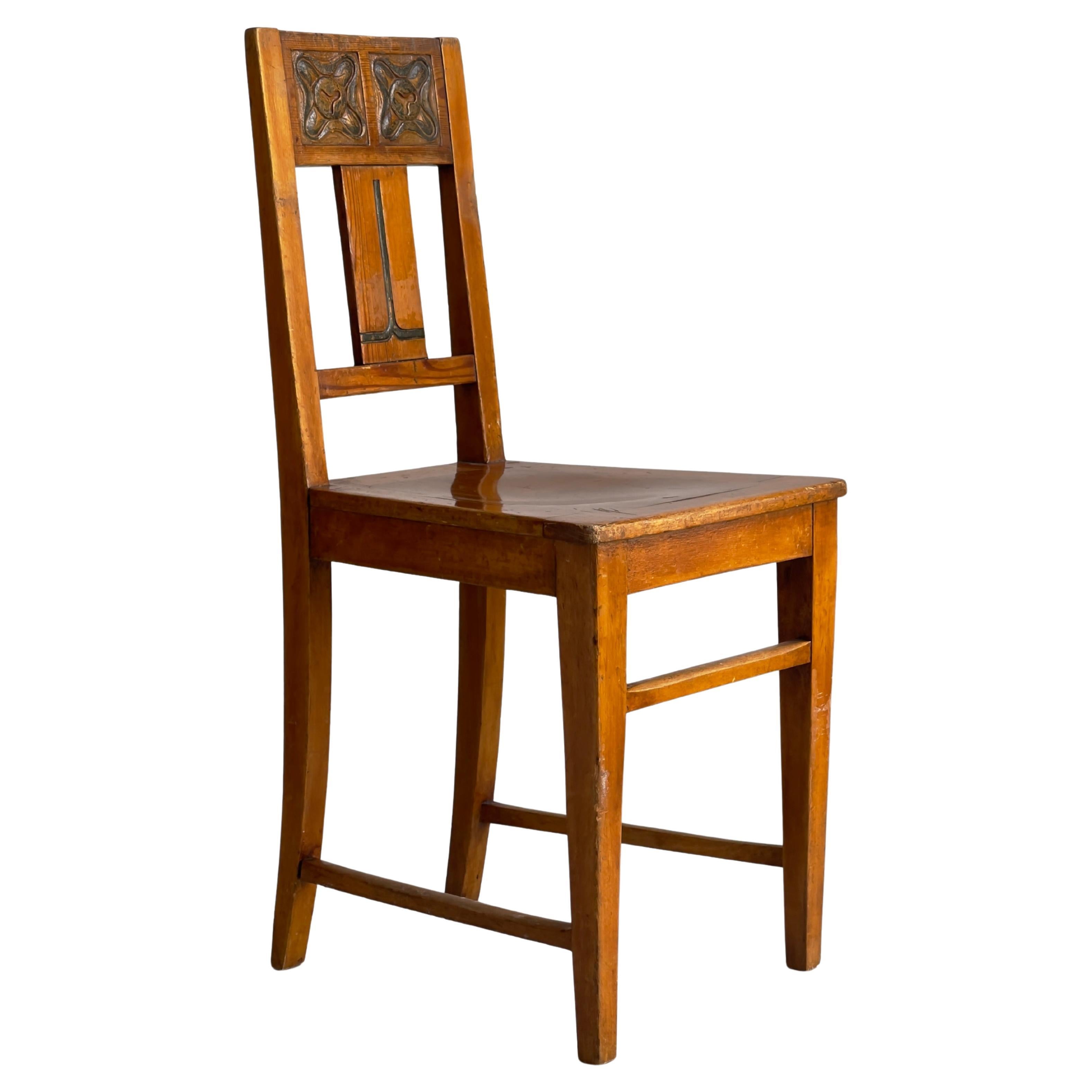 Original Danish Art and Craft chair in pine and beech with green carved decor. For Sale