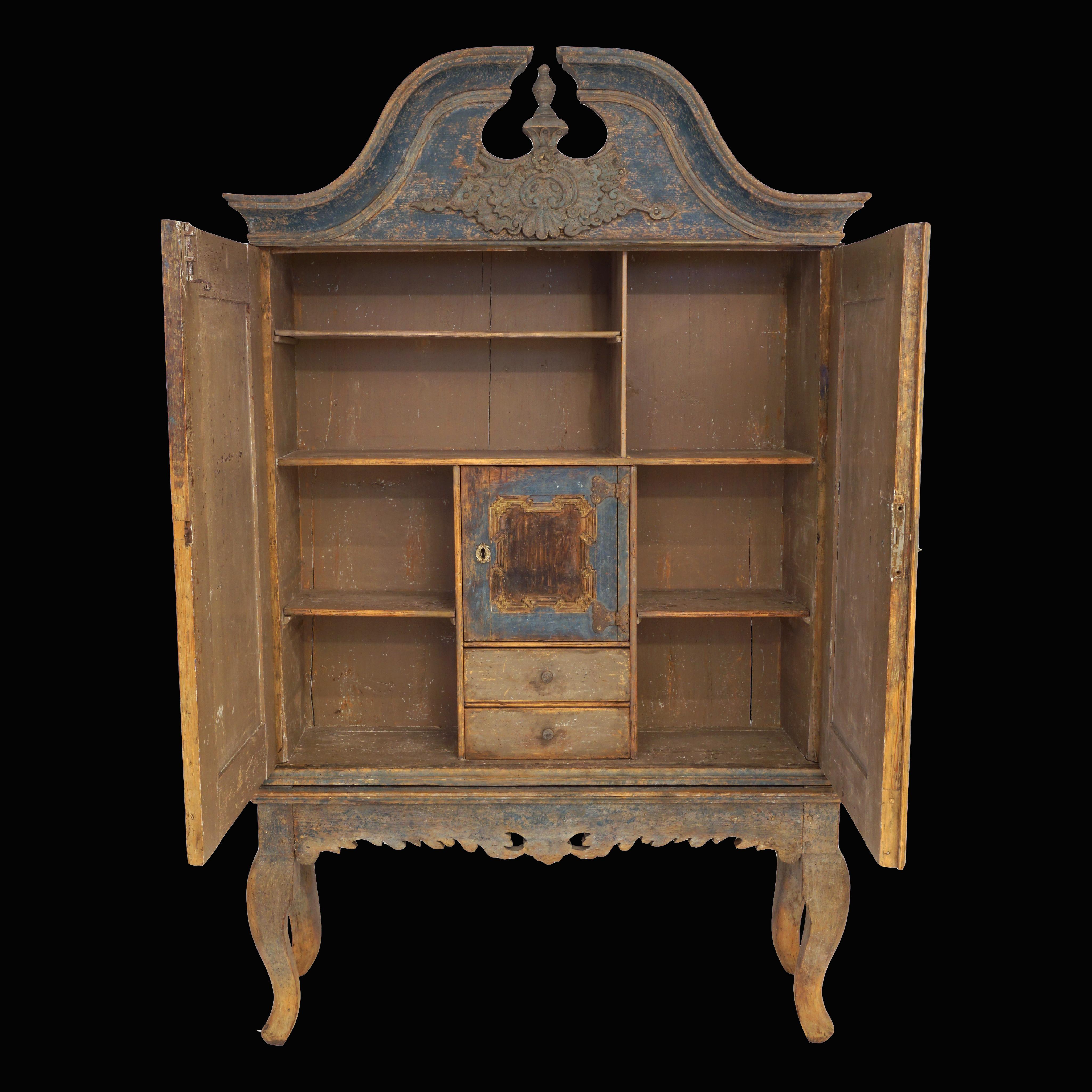 Original decorated mid 18th century Swedish Baroque cabinet. 
A very charming and original piece of furniture with a secret storage room.