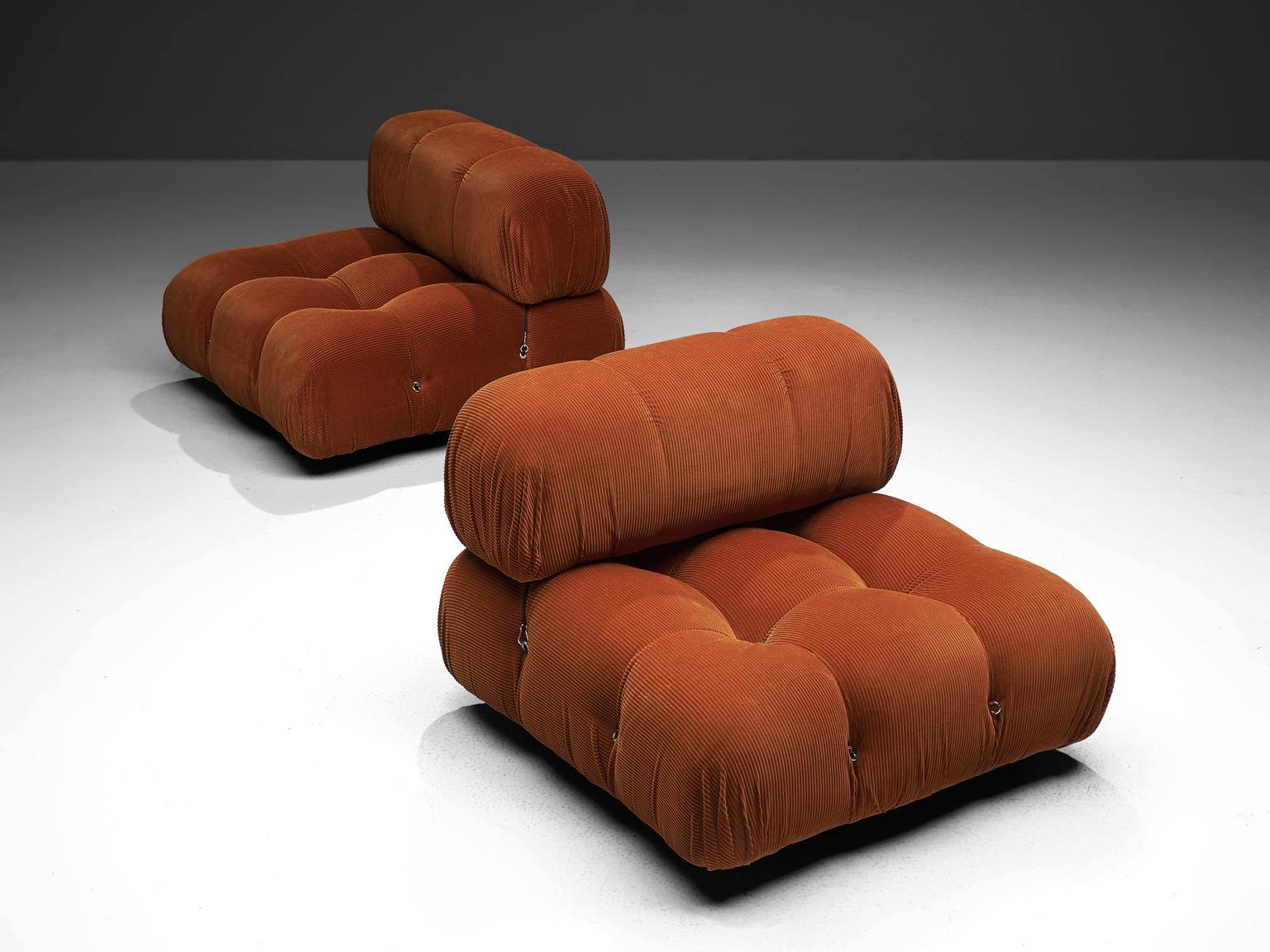 Mario Bellini, modular 'Cameleonda' sofa in dark orange fabric, Italy, 1972.

The sectional elements of this can be used freely and apart from one another. The backs and armrests are provided with rings and carabiners, which allows the user to