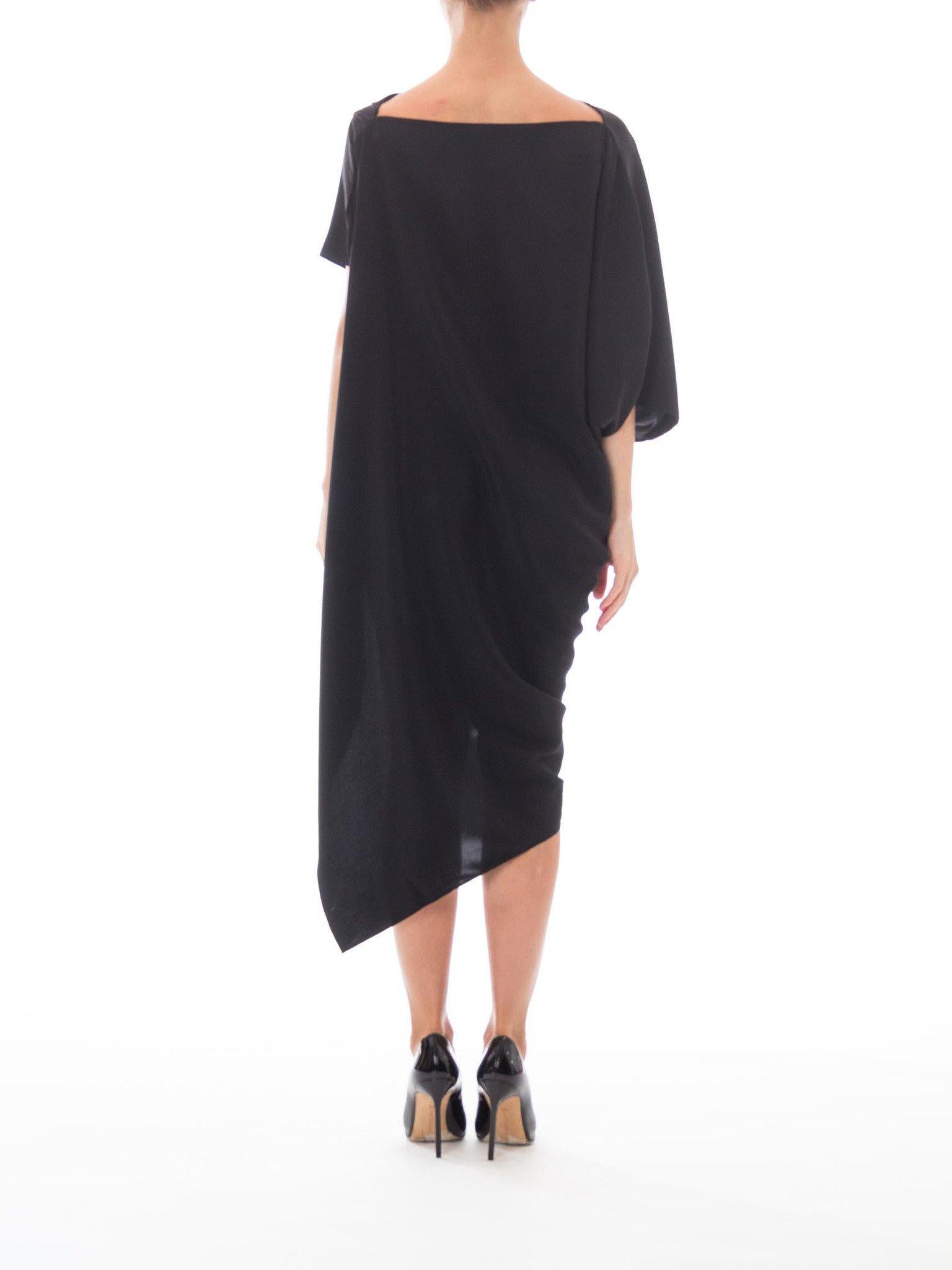 Original Design Avant-Garde 1990S Style Black Silk Charmeause Draped Minimalist Asymmetrical Hem
MORPHEW COLLECTION is made entirely by hand in our NYC Ateliér of rare antique materials sourced from around the globe. Our sustainable vintage