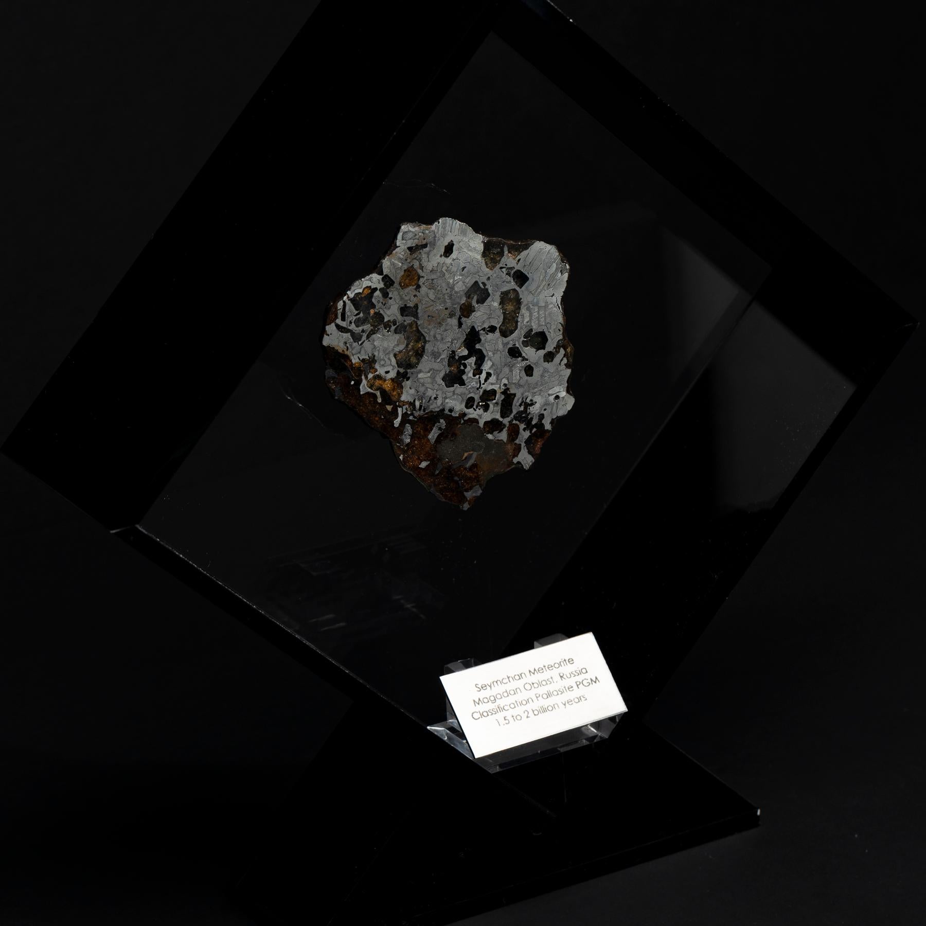 Contemporary Original Design, Seymchan with Olivine Meteorite in a Black Acrylic Display For Sale