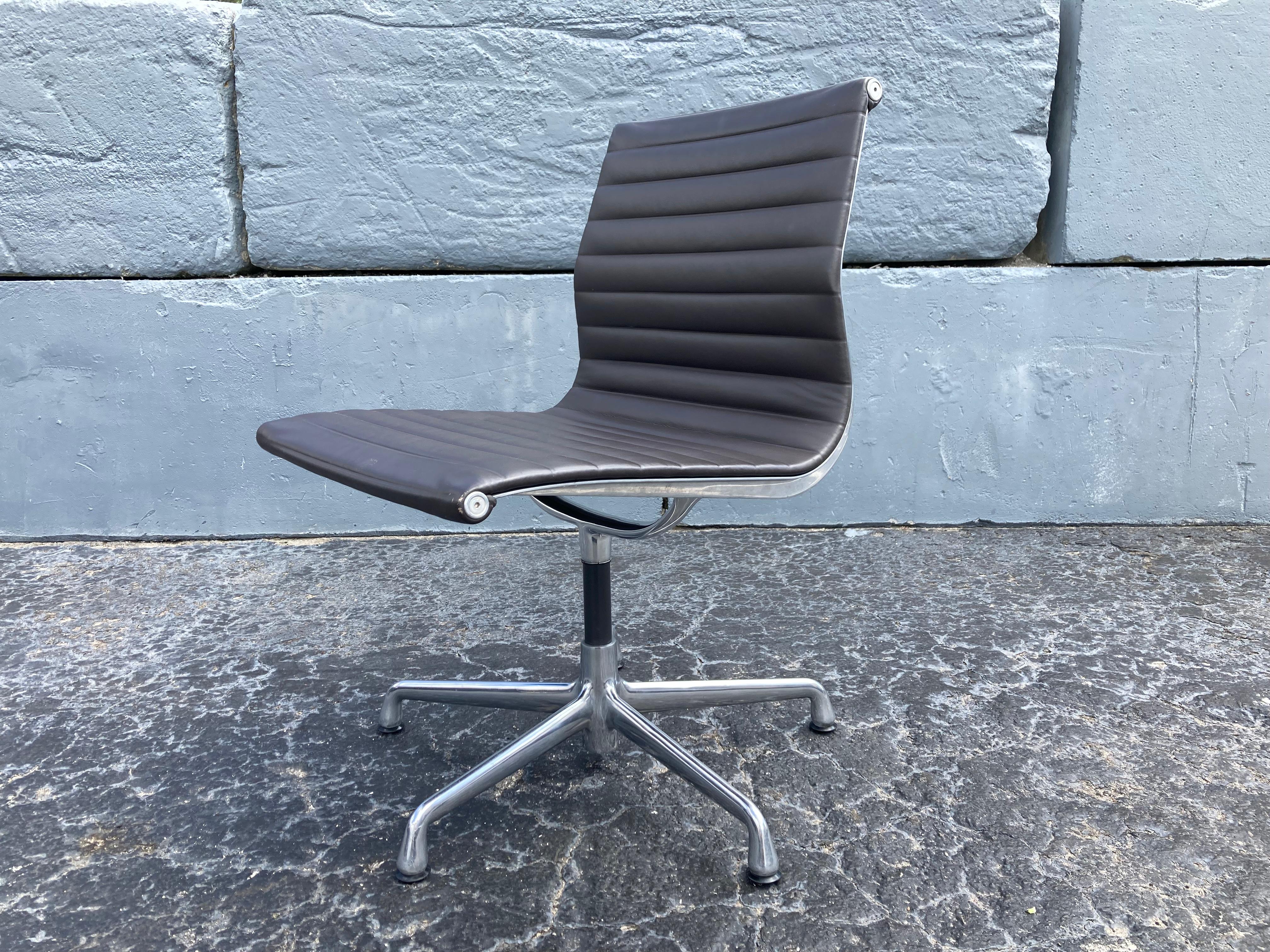Eames swivel leather aluminum group side chairs. Chairs are from 2007 and 2009. We believe the leather is the chocolate color. Eighteen chairs available.