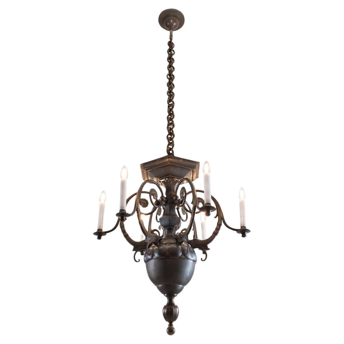 A richly figurative ornamented chandelier in patinated bronze, the given measures are without the chain.

The total drop of this chandelier can be custom made.