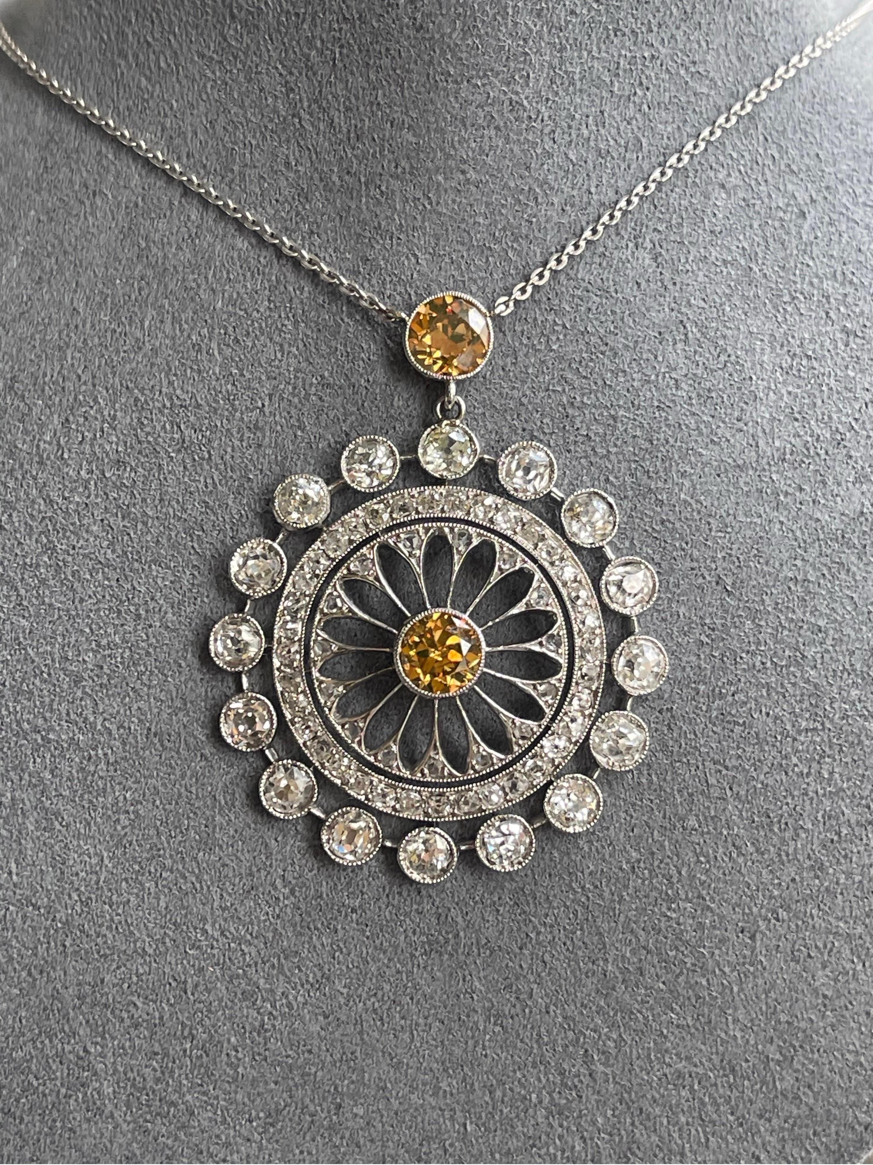 A beautiful Original Edwardian Circular Open Filigree Diamond Necklace.
The large top and center diamonds are a orange brown color approx. 1.10 CTW and the rest is embellished with white old european diamonds & mixed old cuts= Approx. 3.00