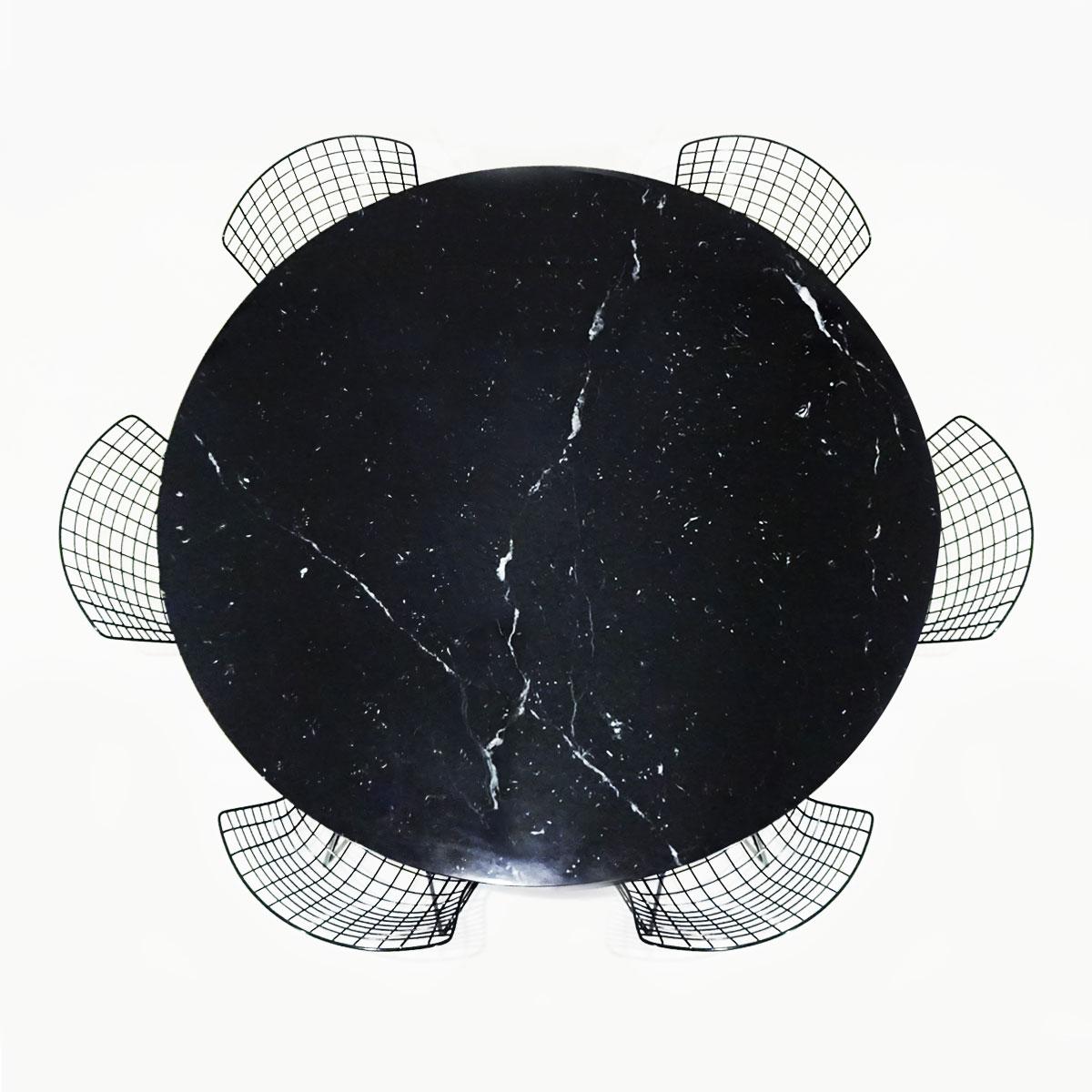 A Classic midcentury dining set comprising an original black Nero Marquina marble Eero Saarinen round tulip dining table matched to 6 original black Harry Bertoia wire chairs with original seat pads, both produced by Knoll.

This is a Classic