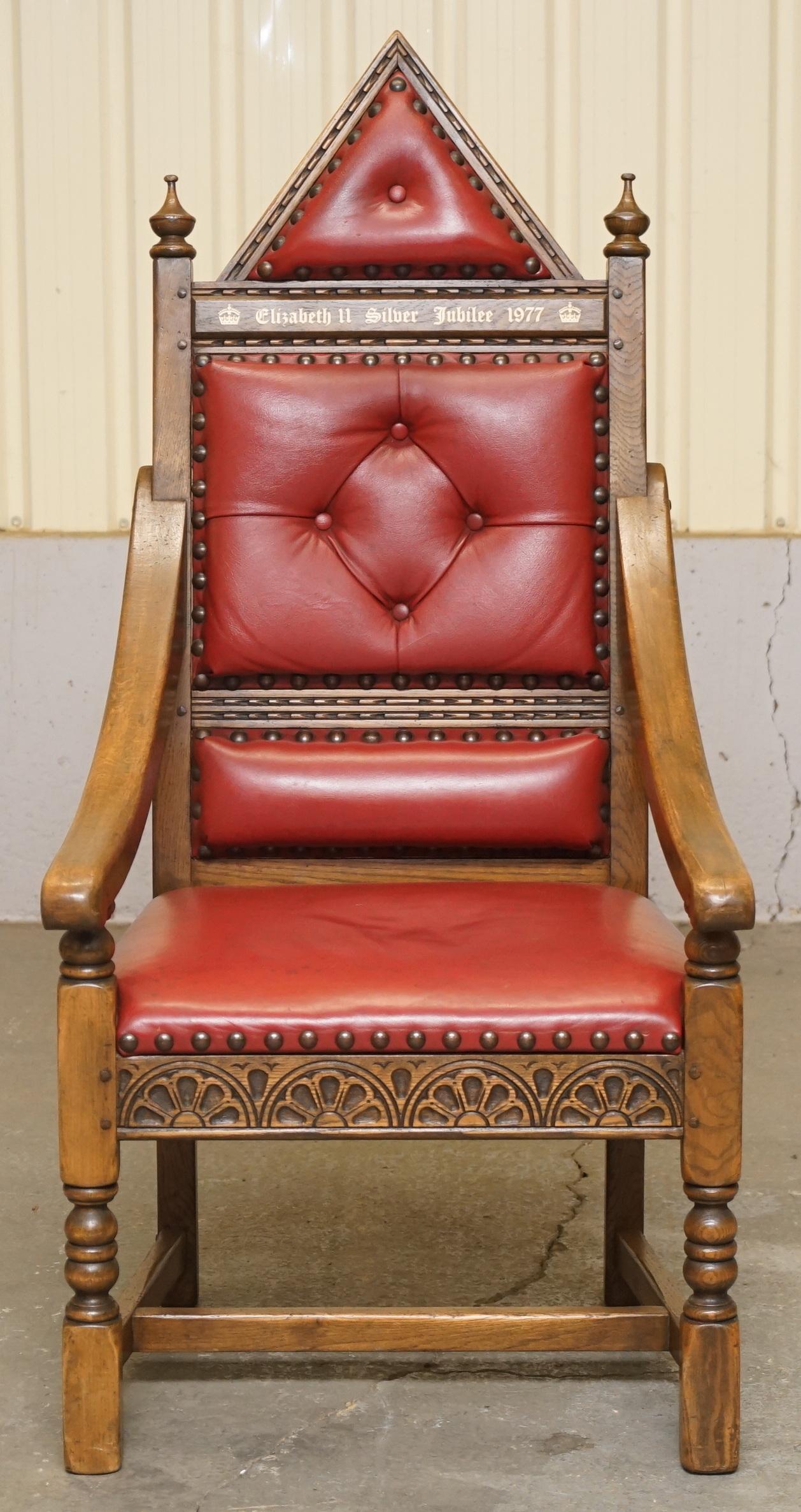 We are delighted to offer for sale this stunning original 421/500 Elizabeth II Silver Jubilee English Oak and Ox Blood leather throne armchair

A very good looking well made and decorative piece of art furniture, In the year in which Queen