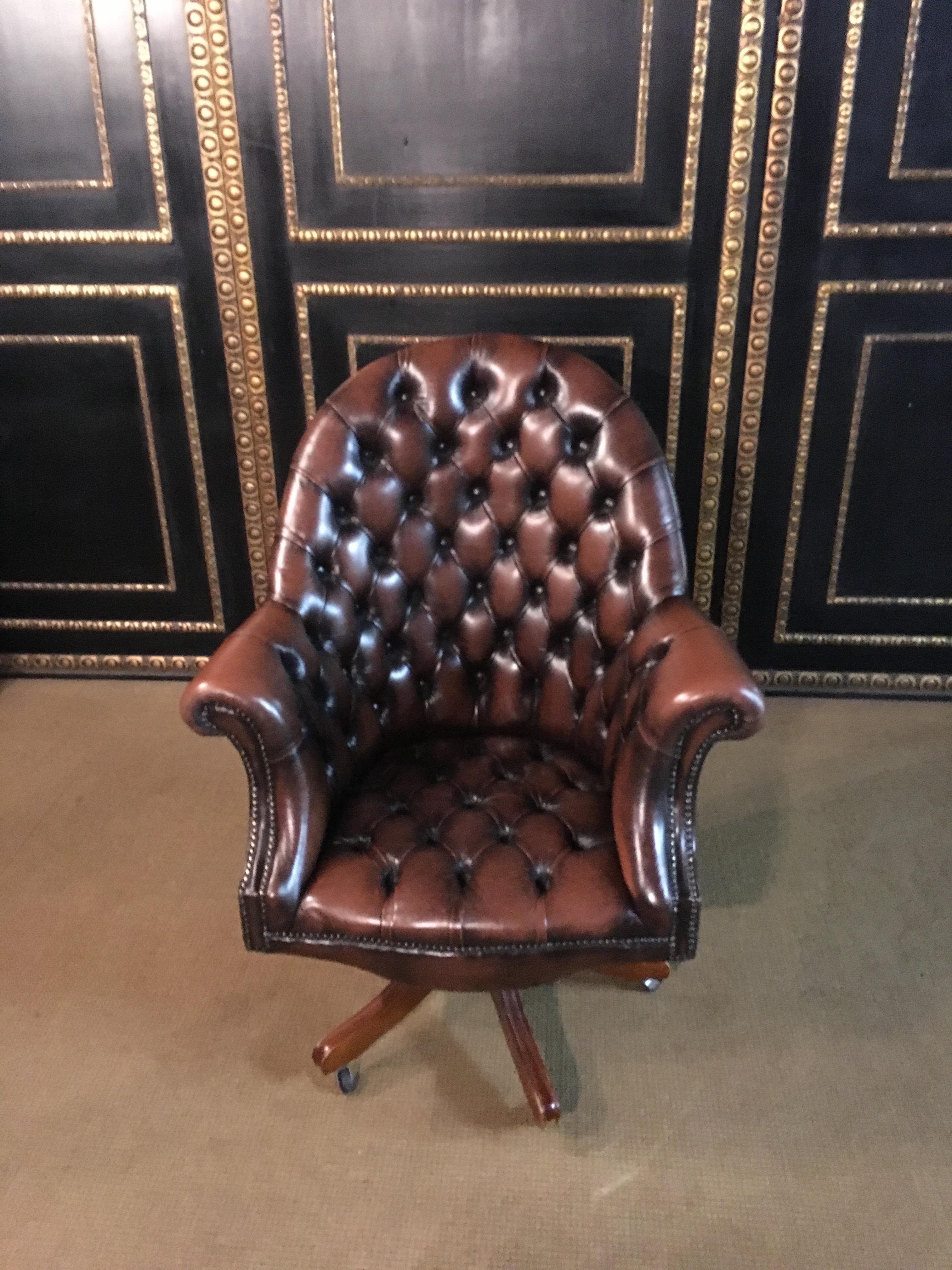 The Chesterfield chair is of an unusually large size.
The back of the chair and the seat are deep buttoned.
It is also possible to revolve the chair and to tip it.