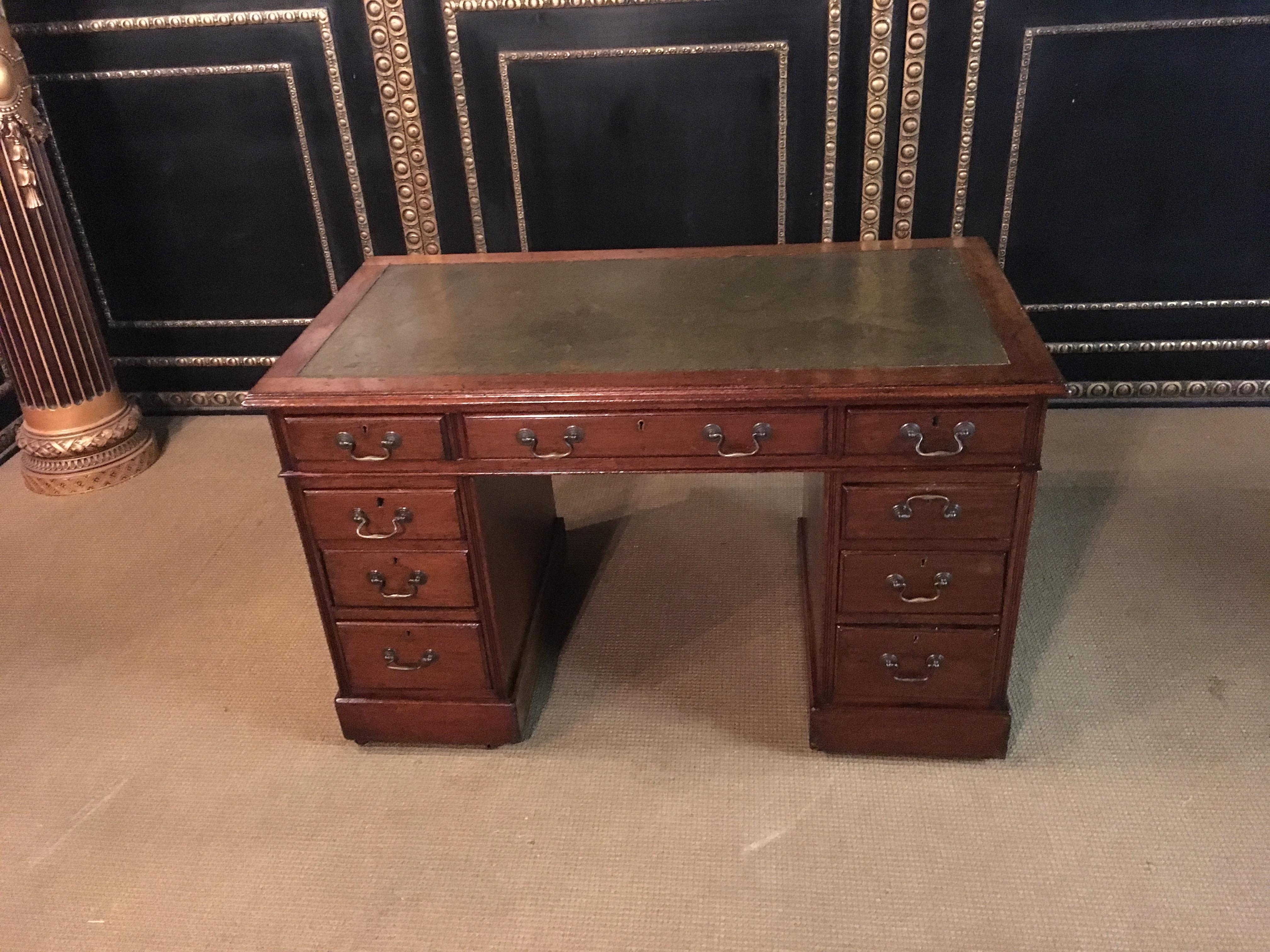 Original English desk with leather plate.

The desk consists of 3 parts, plate and right and left containers.
The desk still has the original metal feet.
Mahogany veneer.

Top with a nice leather plate with gold decoration, real gold leaf.