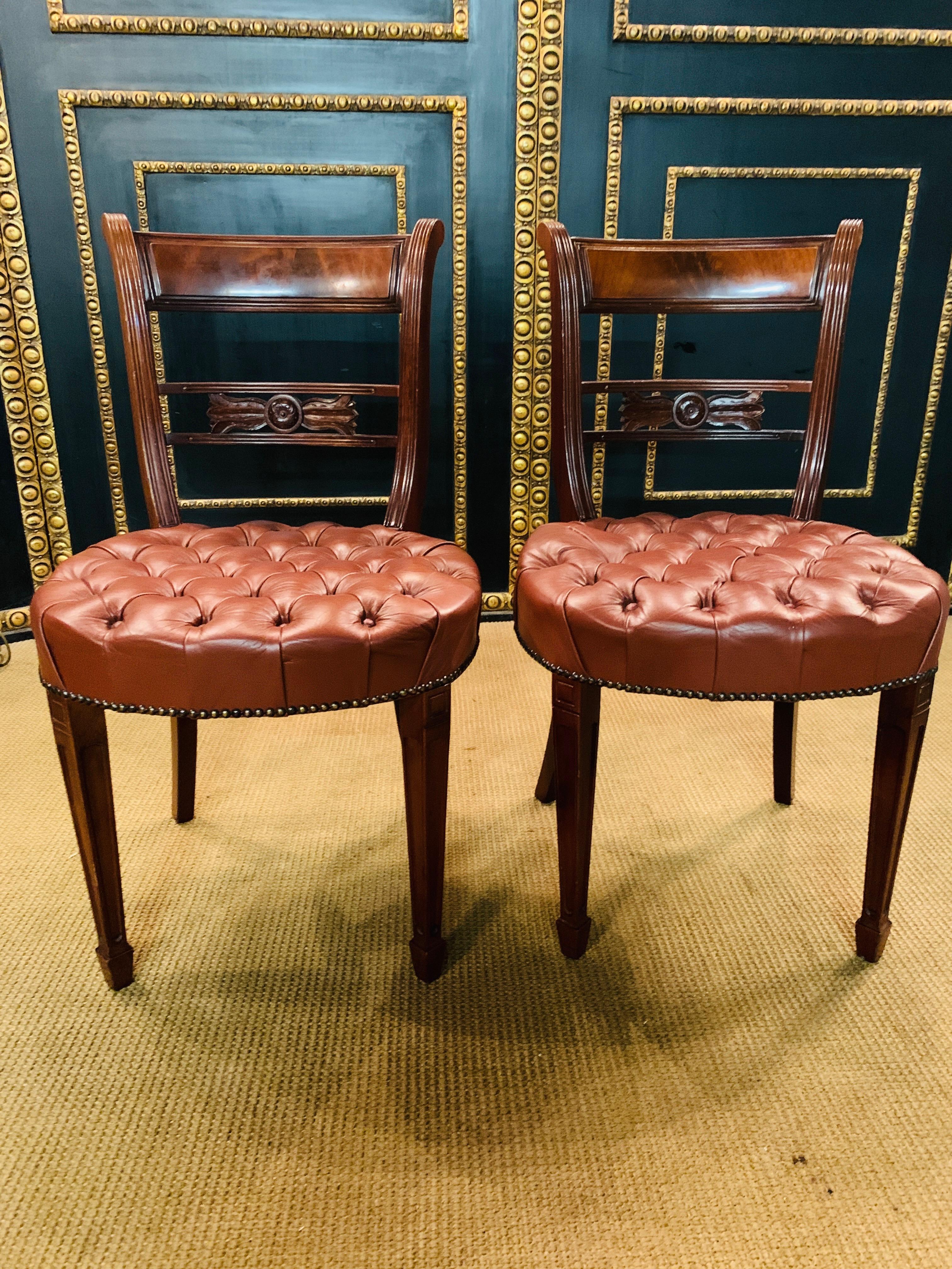 Massive mahogany on four tapered legs. Slightly curved backrest frame with a broad finish. Quilted seat, padded and covered with classic genuine Leather.