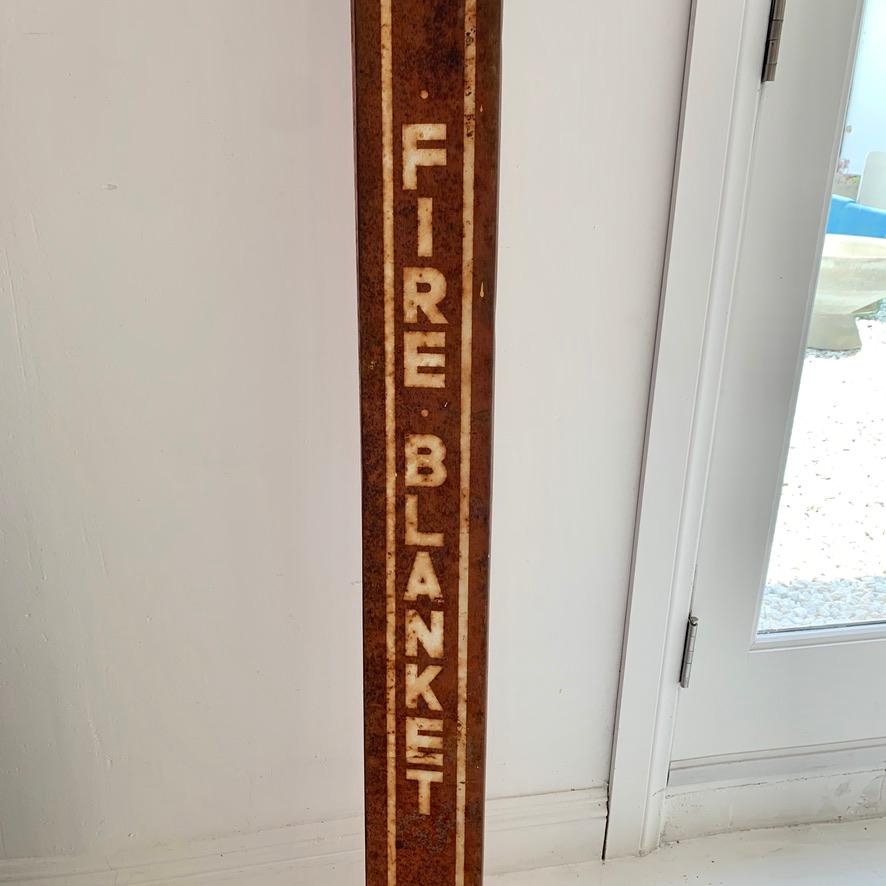 Unique piece of fire/safey history. Metal Fire Blanket sign/holder. Measure: 5.5 feet tall. Made by Mine Safety Appliances Co. Pittsburgh PA. Original fire blanket seemingly unused inside. Sign is in good shape although doesnt stay completely closed