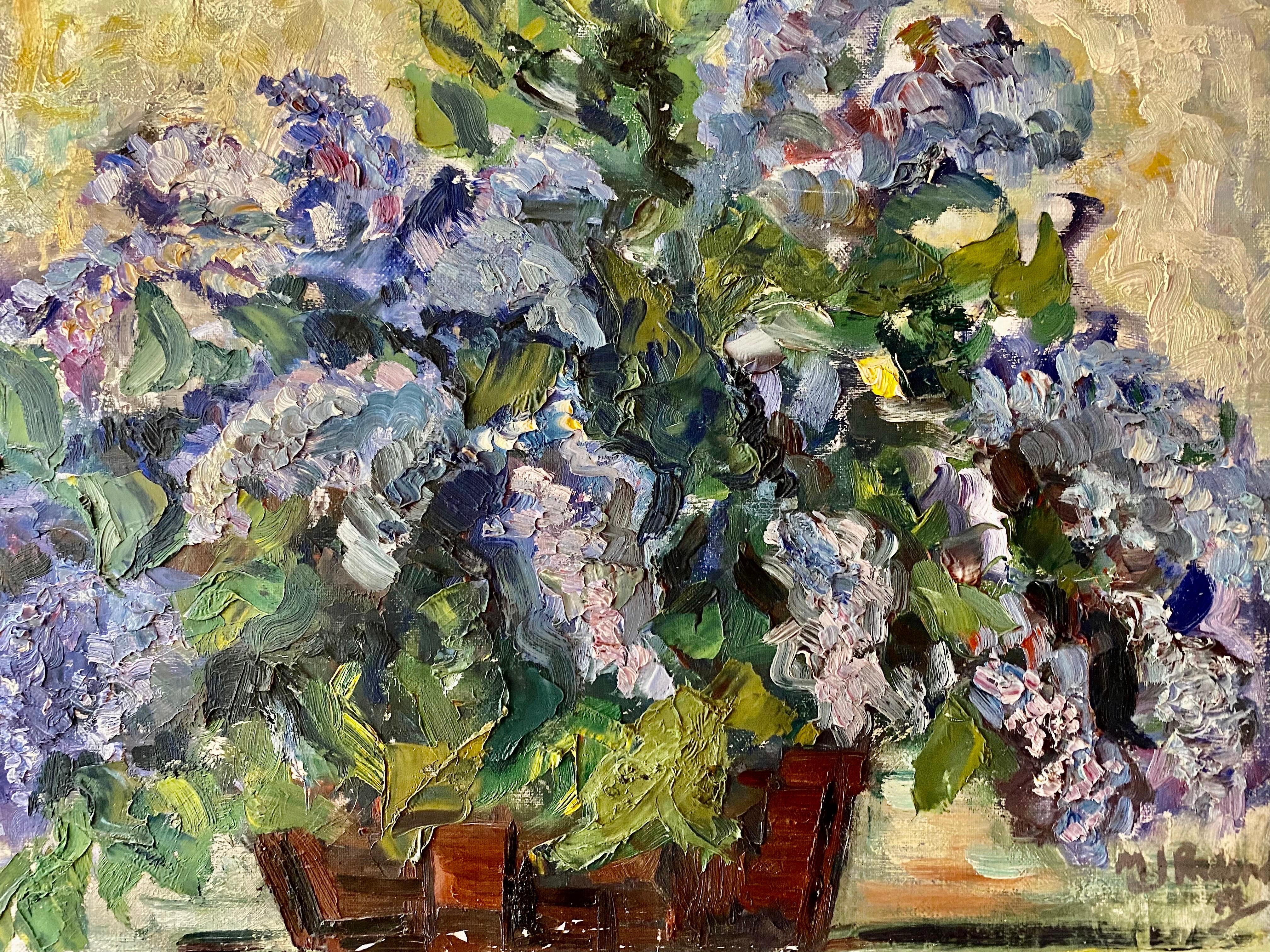 This Spanish still life oil painting captures a scene of a large bouquet of purple and blue lilacs in a brown stained terracotta vase.  He is lying on a fabric, the bouquet is very harmonious, a graceful movement emerges from the stems. The clusters