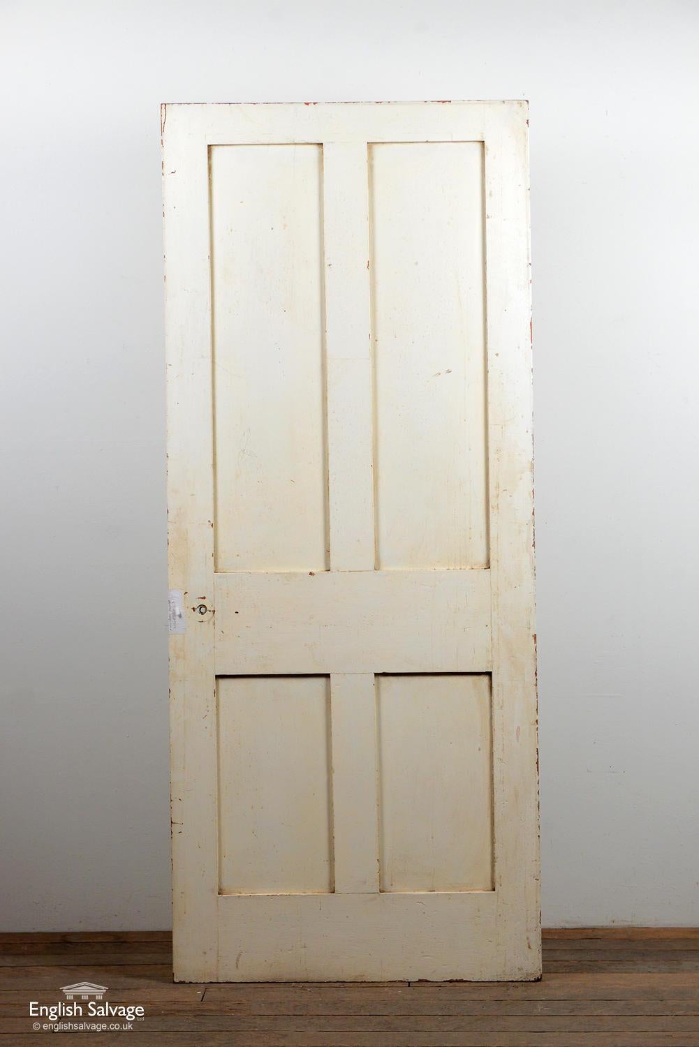 Reclaimed four panel interior door made from pine. Chip to top corner, chips and a few dings plus old lock, handle and nail holes.