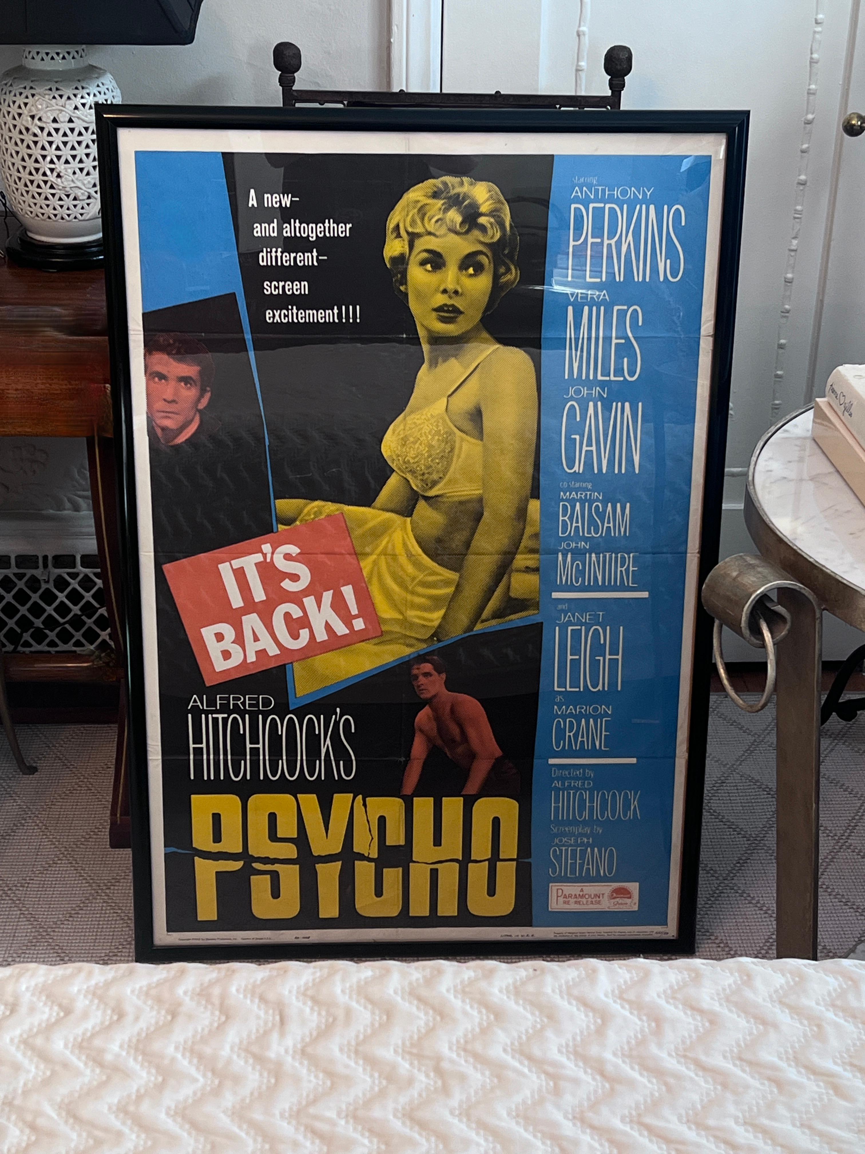 A framed movie poster for the re-release of Alfred Hitchcock's PSYCHO, starring Janet Leigh, Anthony Perkins, and Vera Miles.

The poster was folded, at one point, and some folds are visible (we think this adds to the character and authenticity.

A