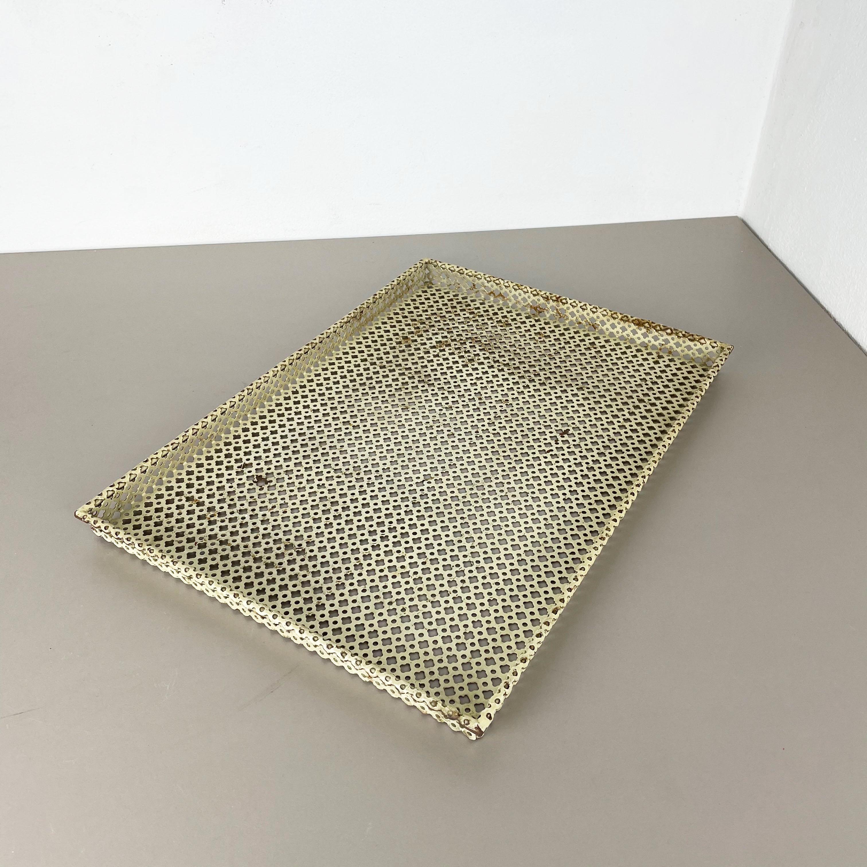 Metal tray.

attributed to be Designed and produced by Mathieu Matégot.

Origin: France, 

1950s.

Original Mathieu Matégot tray designed and manufactured in the 1950s in France. typical mategot style with perforated sheet metal, hole