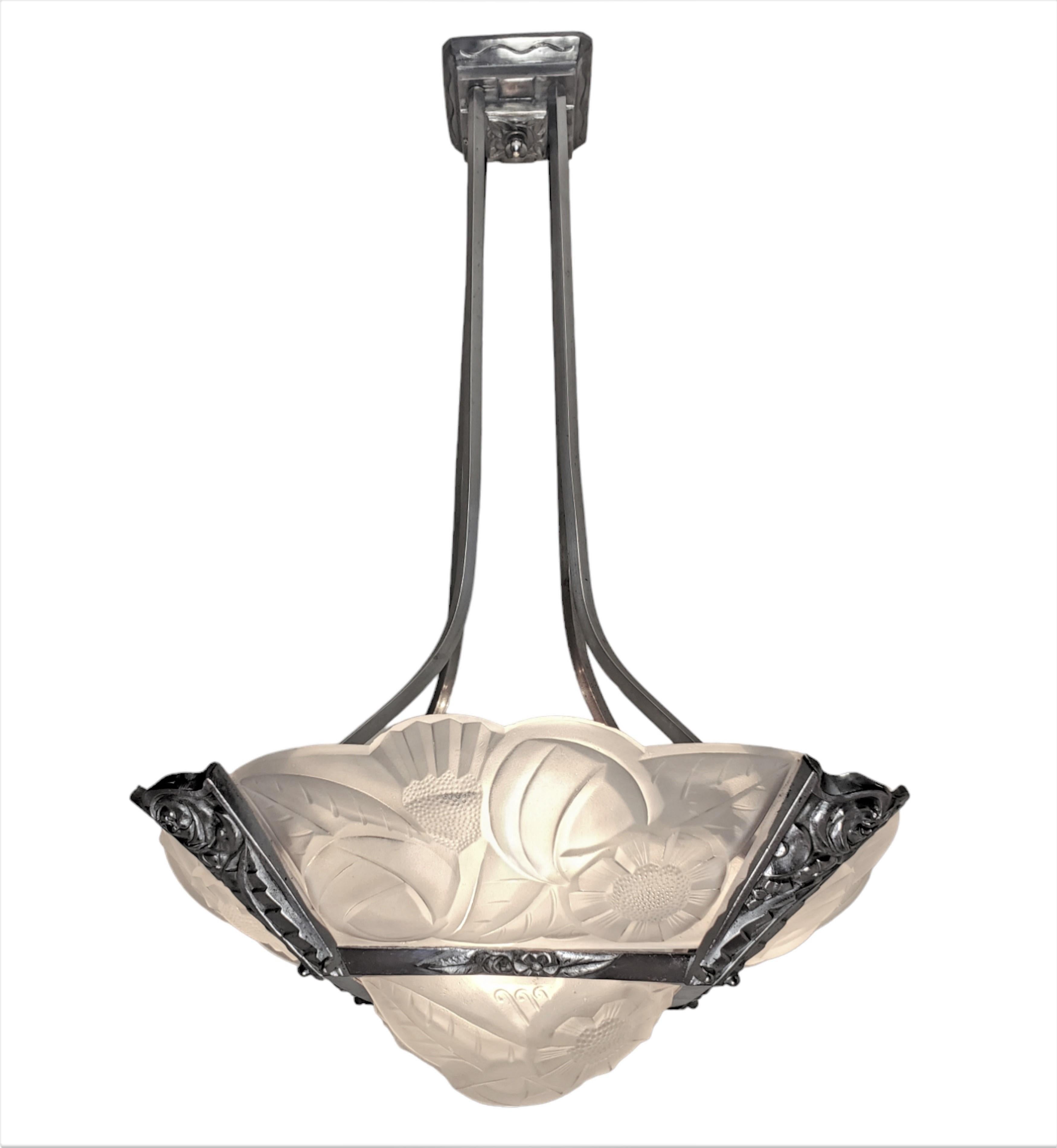 Lovely French Art Deco original signed chandelier featuring four beautifully molded and frosted, scalloped edge glass panels of stylized floral motif along with a matching square molded center glass. 
signed Degue. 
The whole is supported by a two