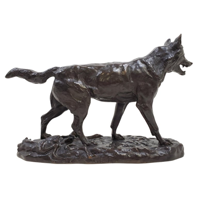 A fine original, French, early 20th century bronze statue of a walking wolf 