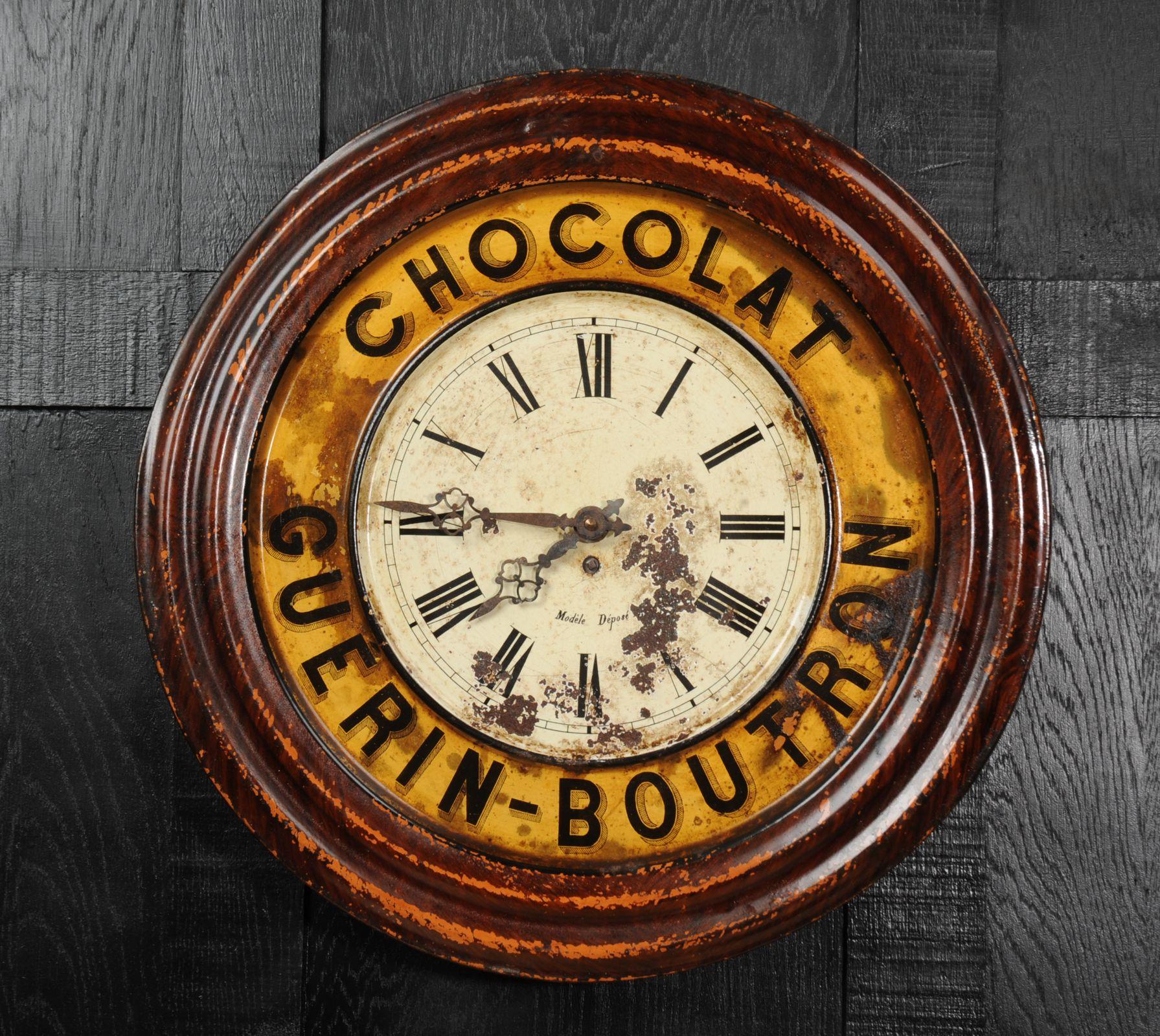 A wonderful original Guerin Boutron tole advertising clock, circa 1920. Found by our buyer in a long derelict French bar it has been worn by years of neglect with a wonderful patina of paint loss and rust. The dial is pock-marked with rust and the