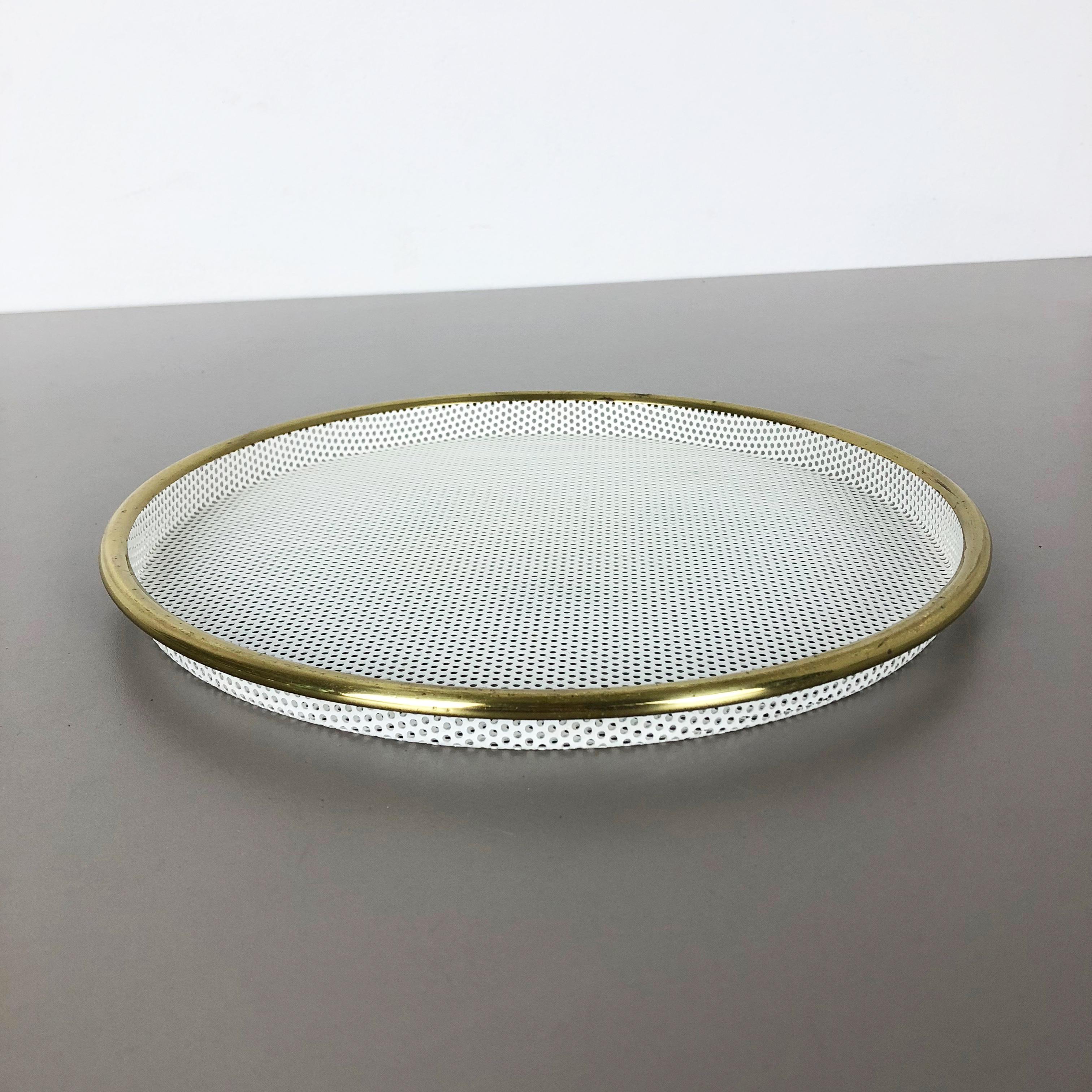 Metal tray.

In style of Mathieu Mategot.

Origin: France, 

1960s.

This original vintage tray element was produced in the 1960s in France. It was made of metal in whole pattern optic which is reminiscent with the designs by Mathieu
