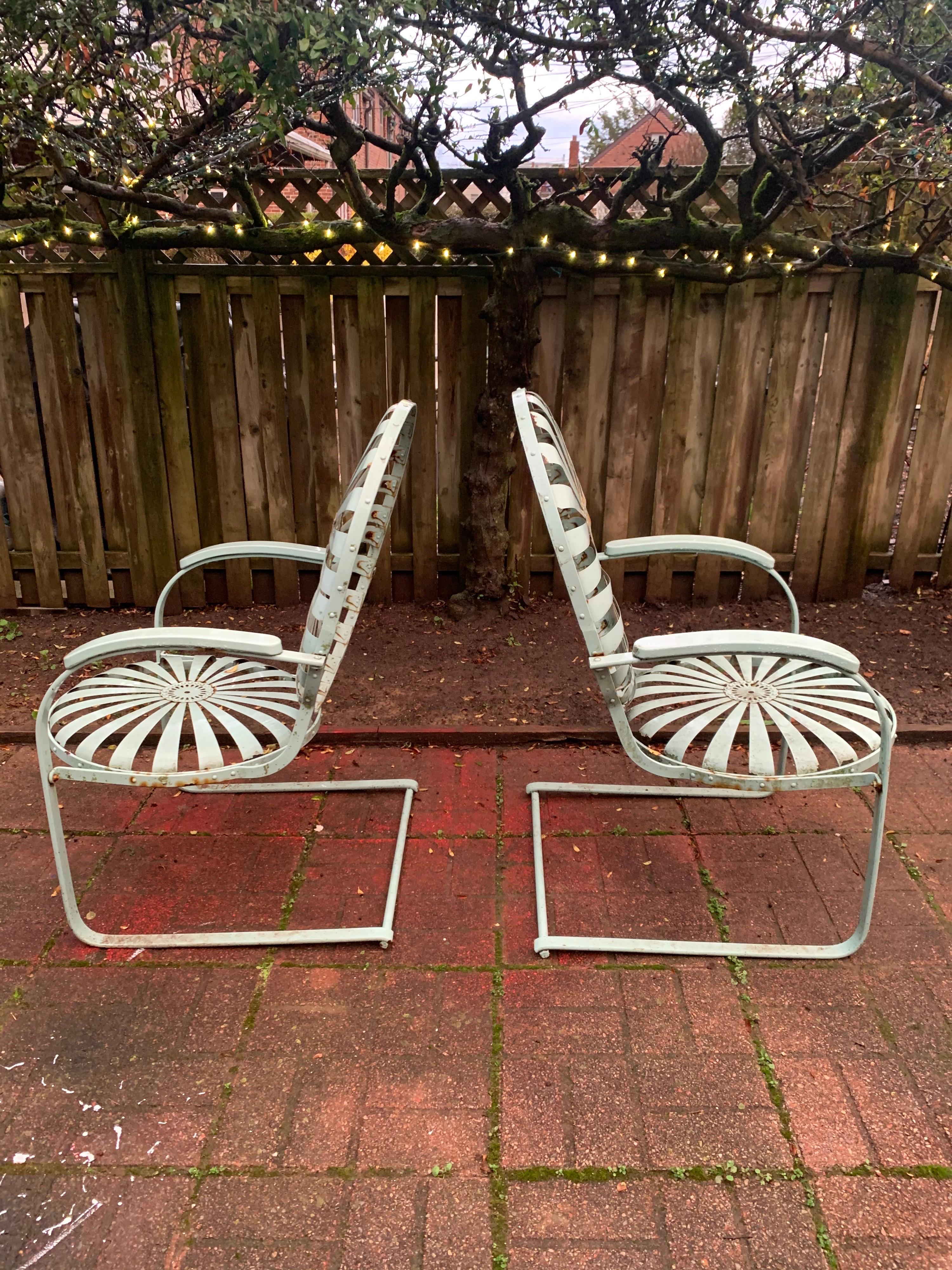 Fantastic pair of Francois Carre sunburst bouncer lounge chairs. 

These chairs are more than just good-looking. 

They are curiously some of the most comfortable lounge chairs we have test-driven. No cushions needed.

Their simple bent-steel