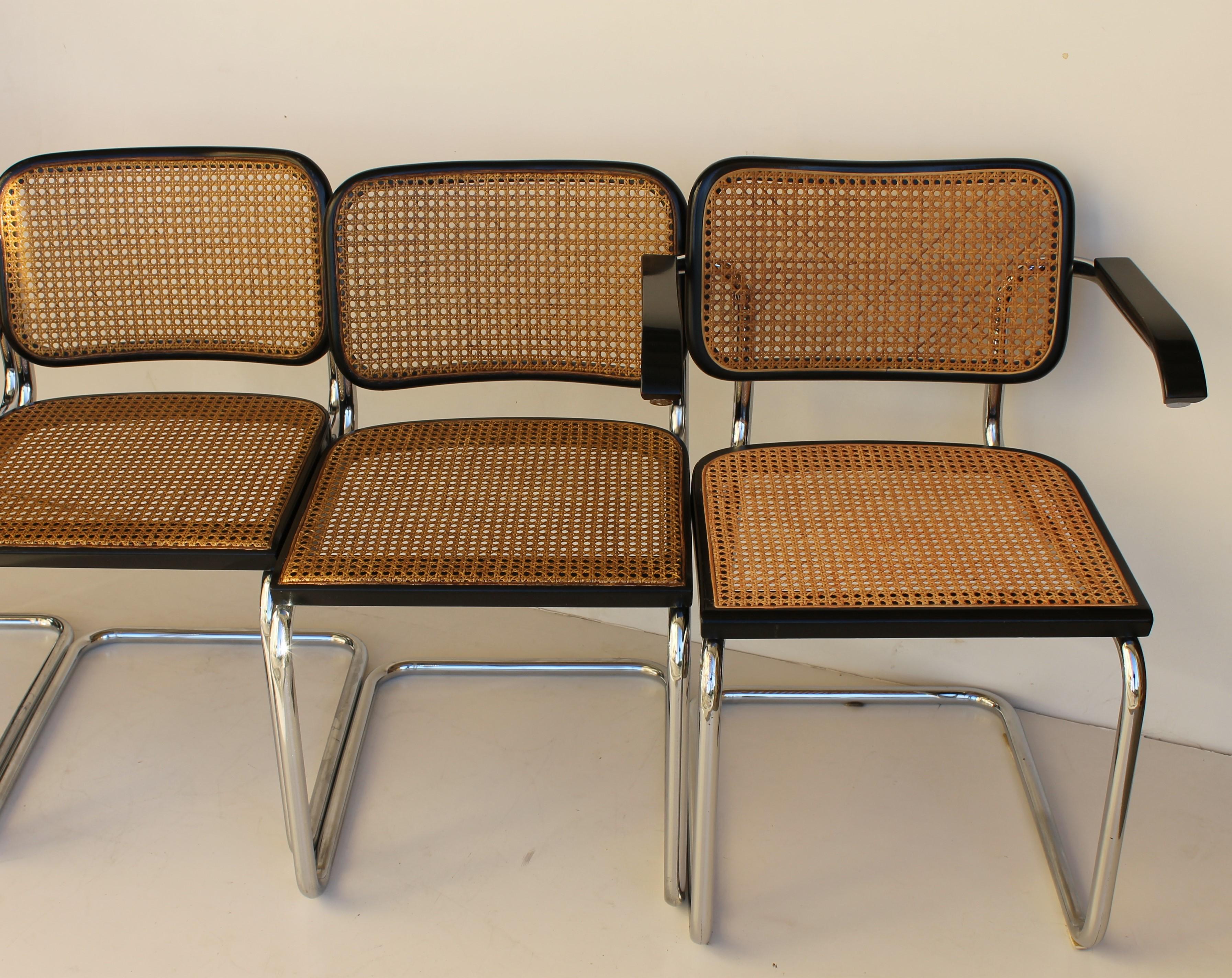 Four Cesca chairs and two armchairs designed by Marcel Breuer for Gavina dated circa 1965 (the project was created in 1928).

All with new seats 
