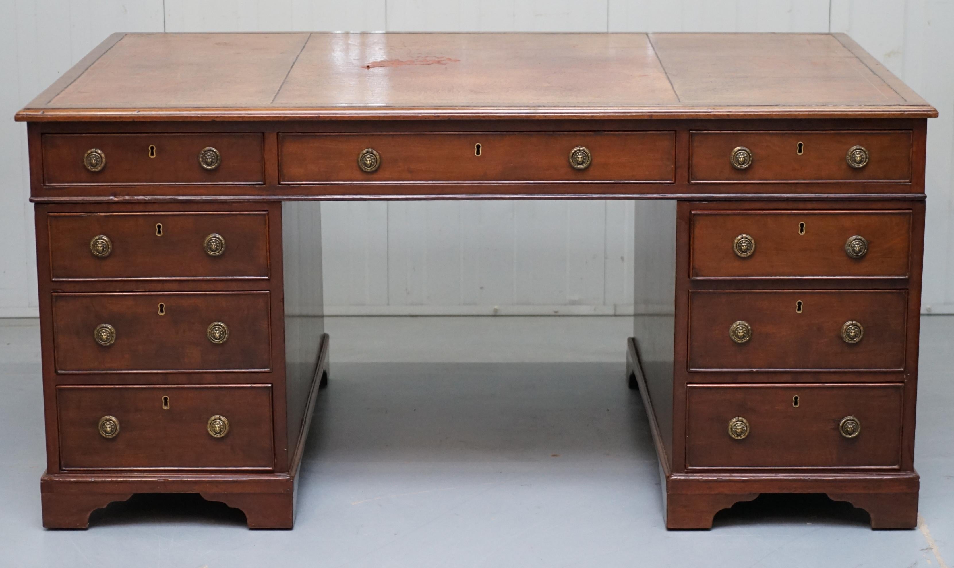 We are delighted to offer for sale this stunning very rare original George III circa 1780 walnut twin pedestal double sided partner desk with Lion head handles and brown leather surface

A very well made late 18th century desk, I have never seen