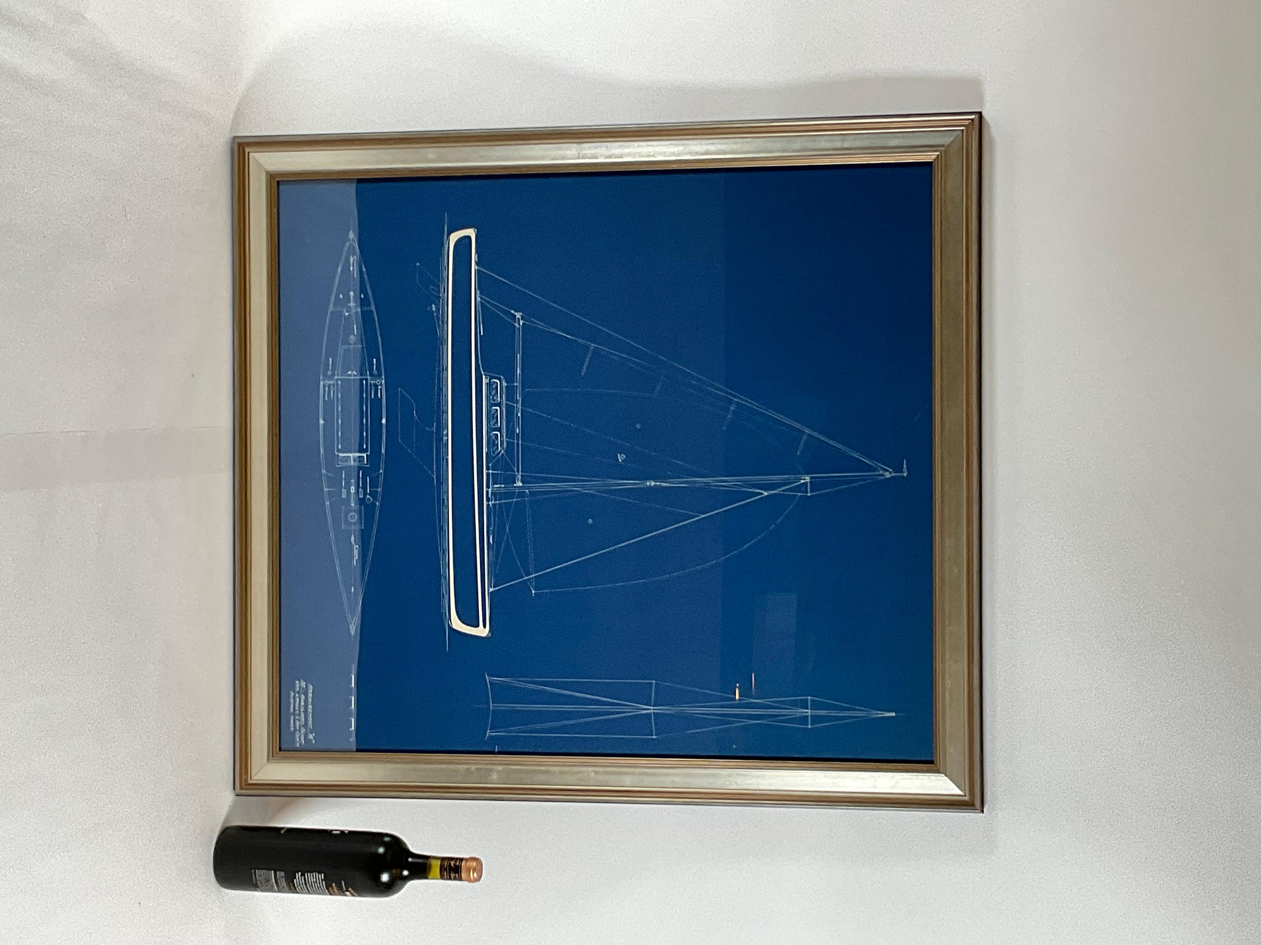Blueprint for a thirty-seven foot sloop from George Lawley and Son boat builders and naval architects. The plan is marked “Arrangement A” on the legend. The profile shows a handsome yacht with cabin, mast, spinnaker pole, boom, tiller, cleats winch,