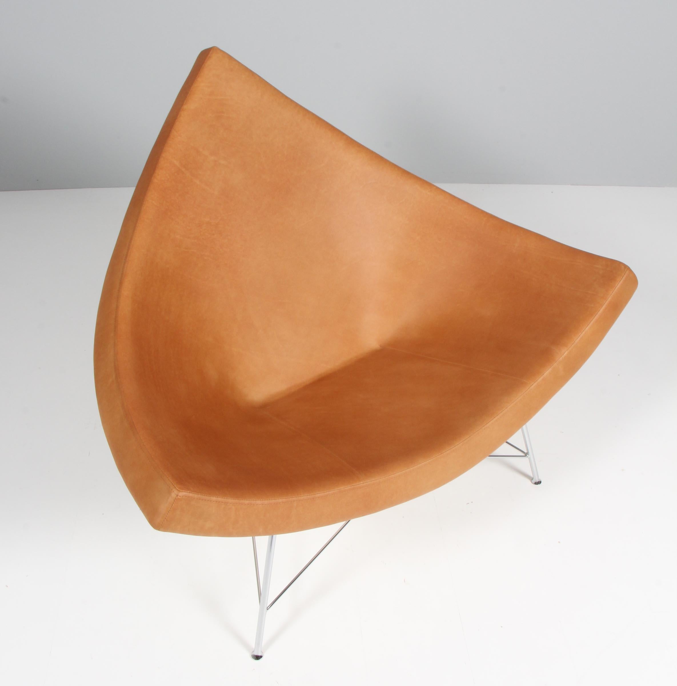 Coconut lounge chair designed by George Nelson for Herman Miller, manufactured by Vitra. new upholstered with vintage cognac aniline leather, white shell and chrome legs.